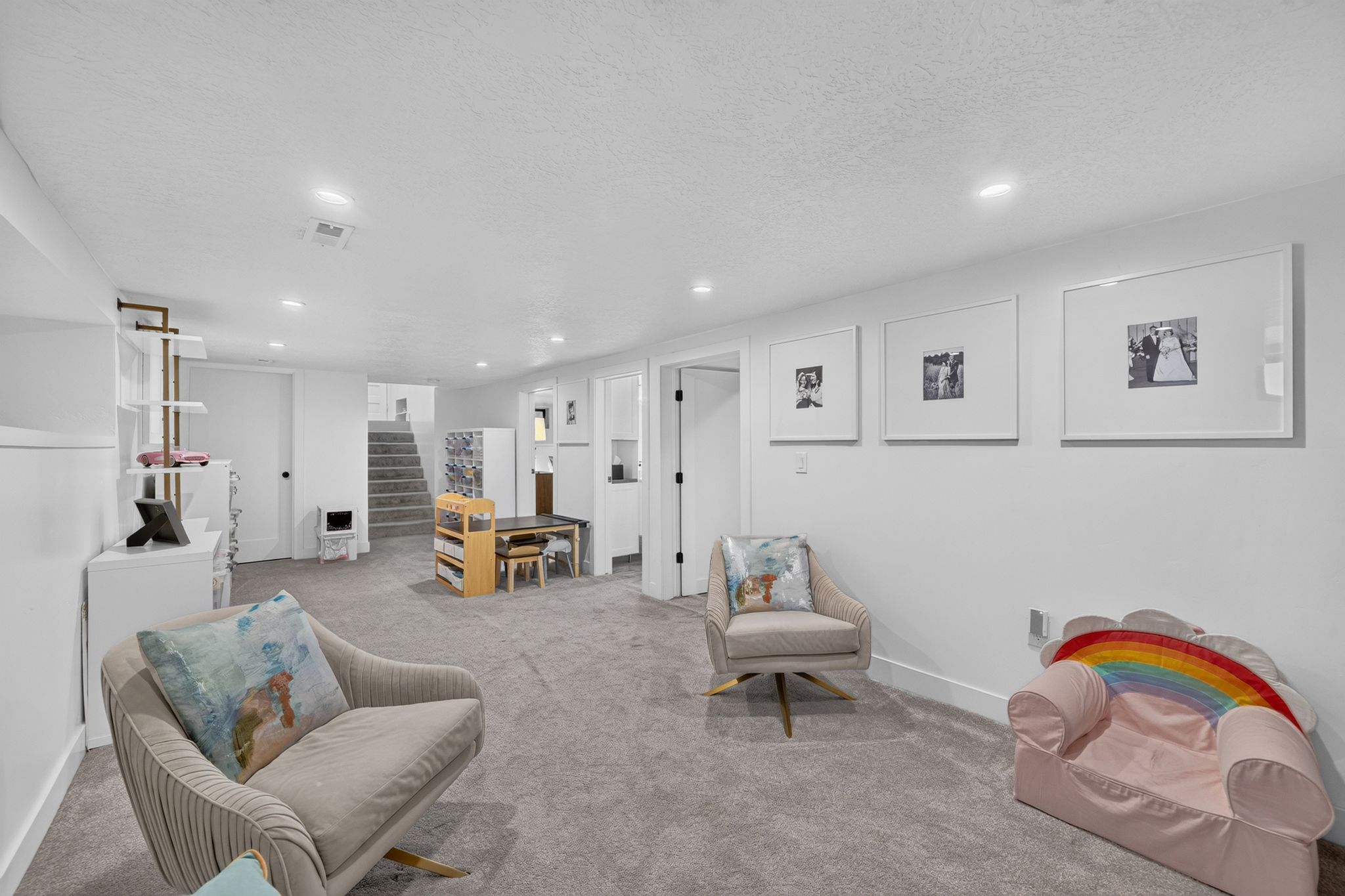 Spacious carpeted room featuring recessed lighting, white walls, and bright white baseboards