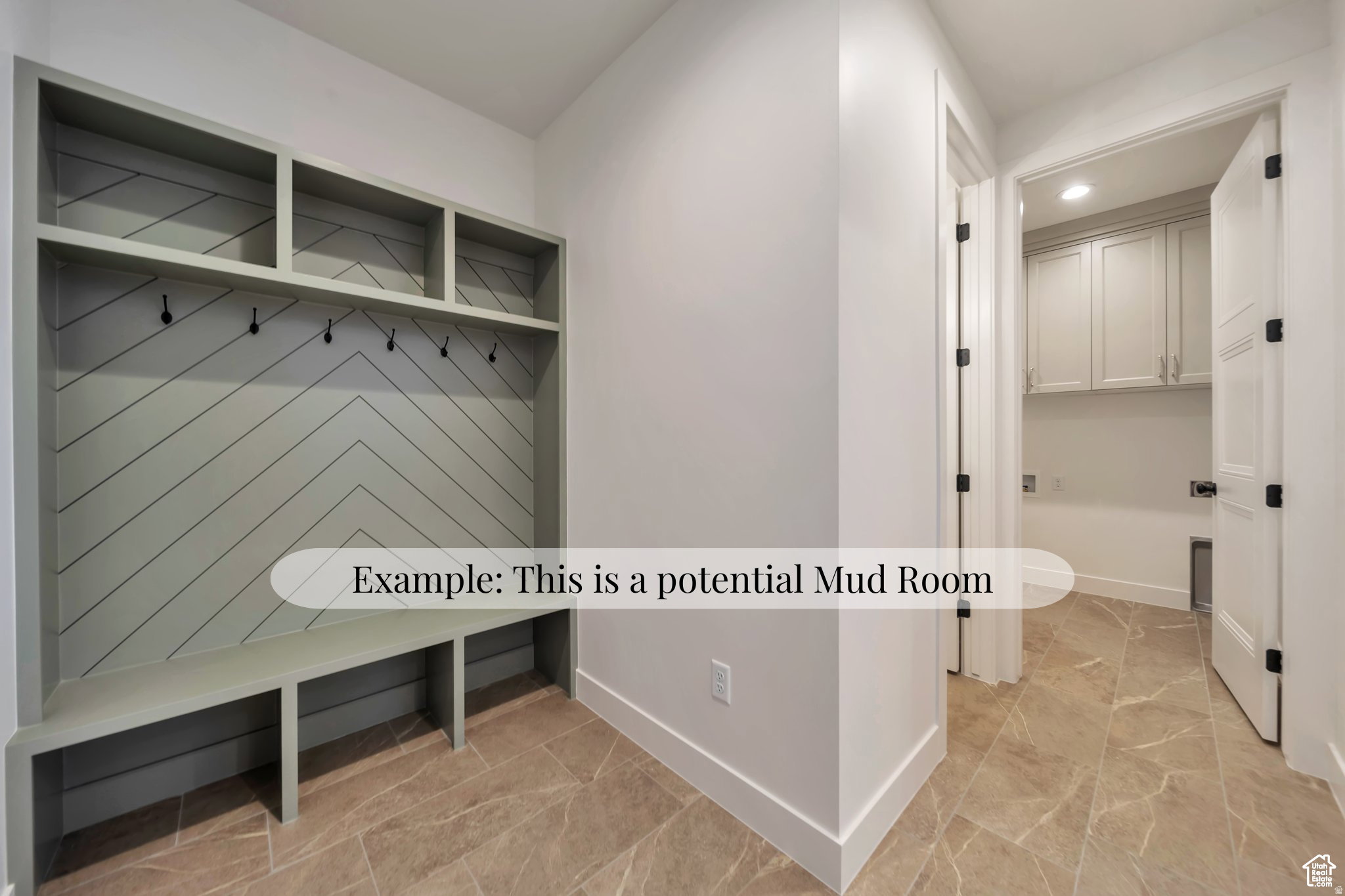 Built-in storage bench with overhead shelving and coat hooks