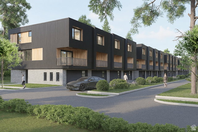 Contemporary townhome featuring a black panel facade and light wood accents