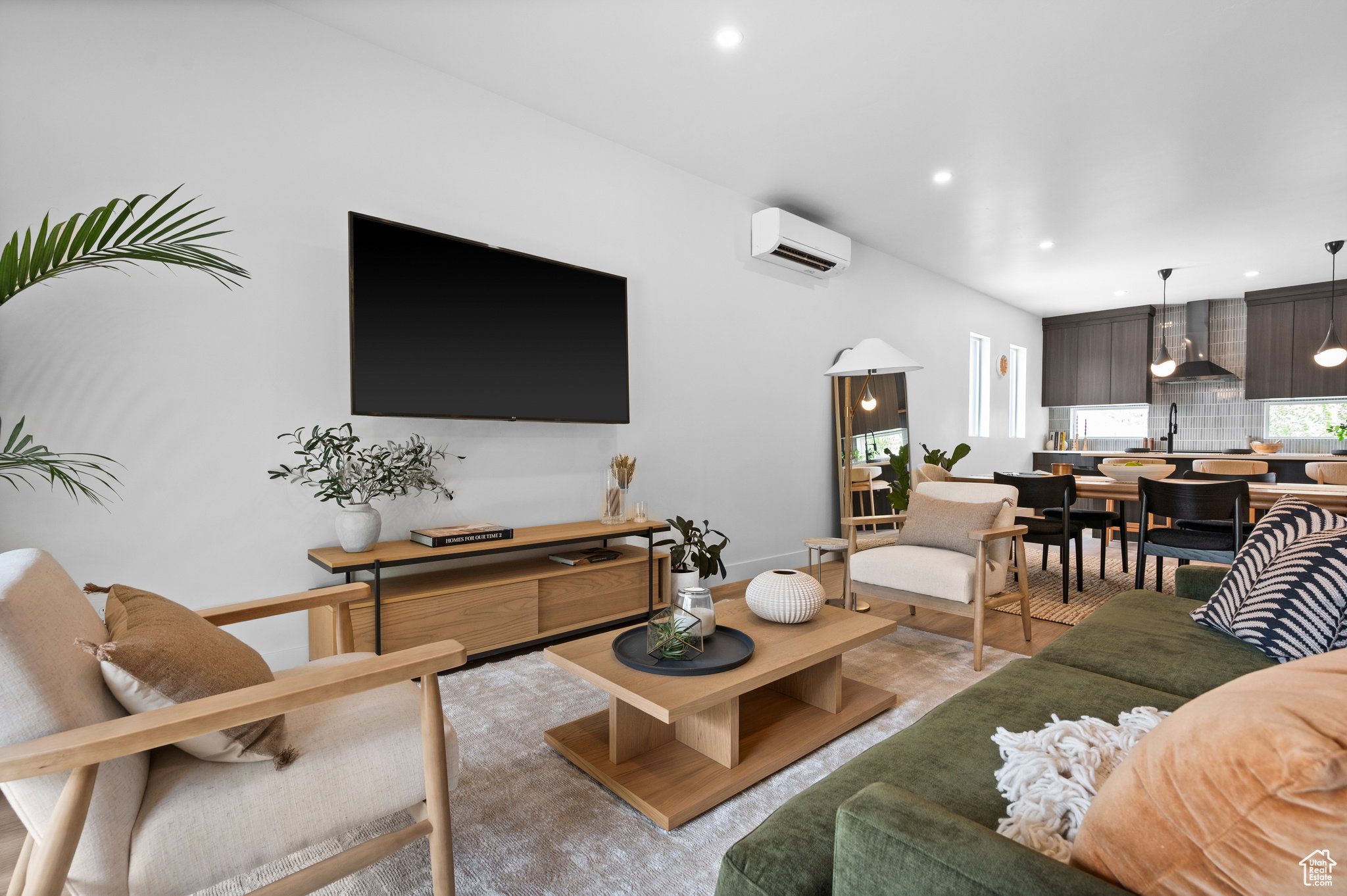 Open-concept living space featuring recessed lighting and light wood-finish flooring