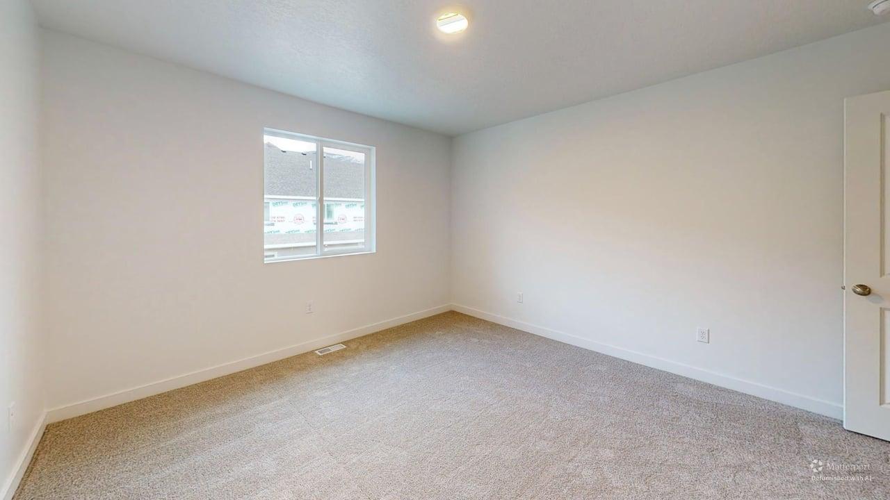 Carpeted room with a double-pane window, white trim, and a flush-mounted ceiling light fixture