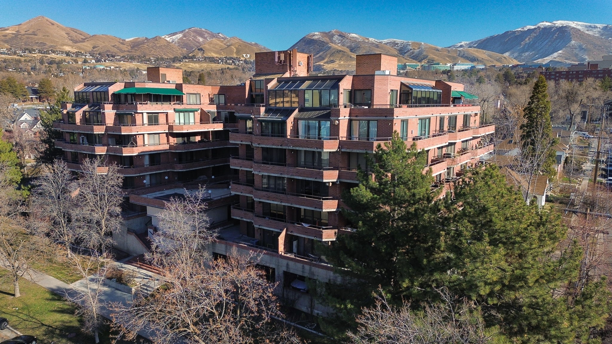 Terraced multi-story building featuring brick exterior construction