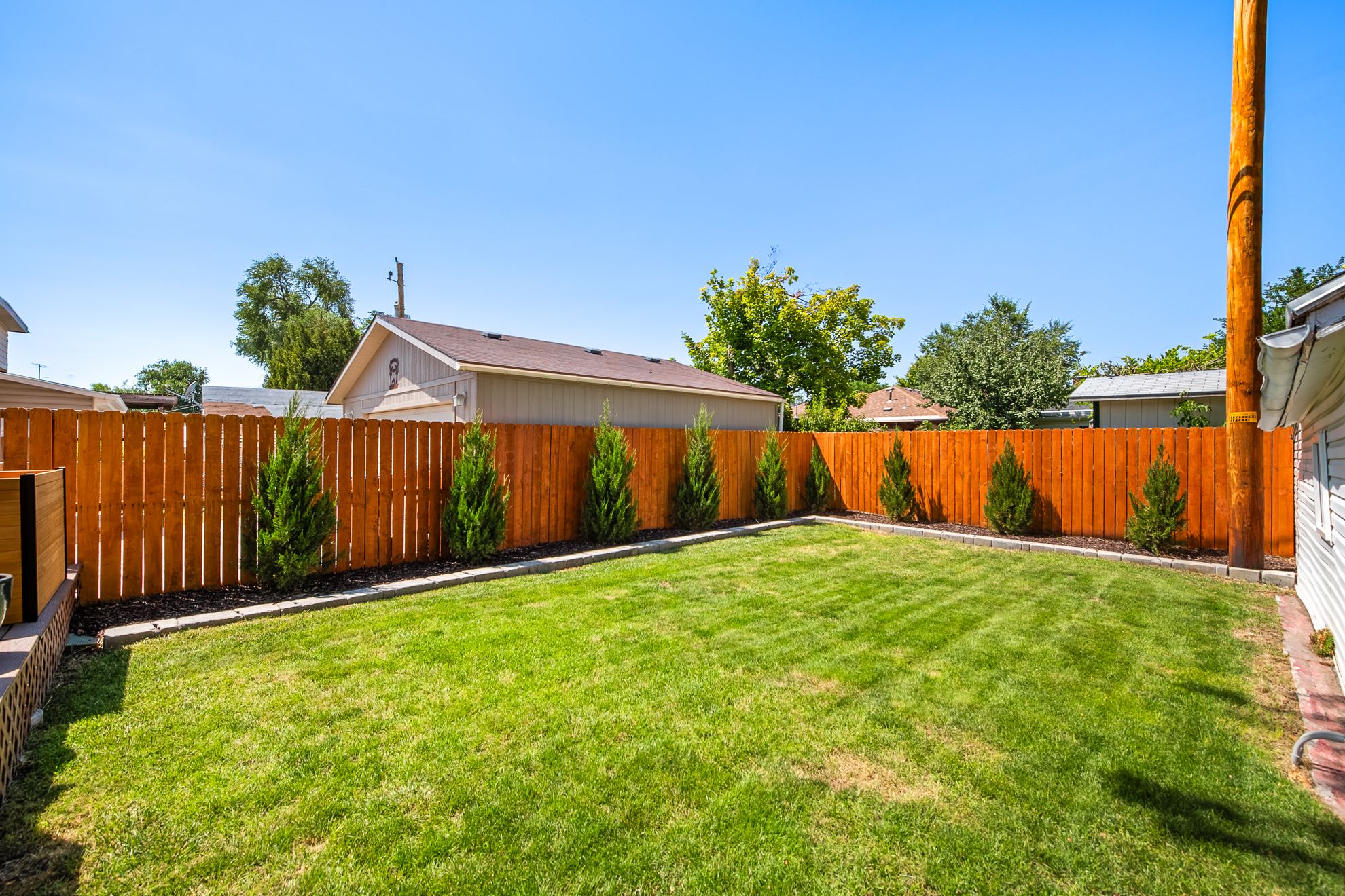 Expansive backyard with a manicured lawn