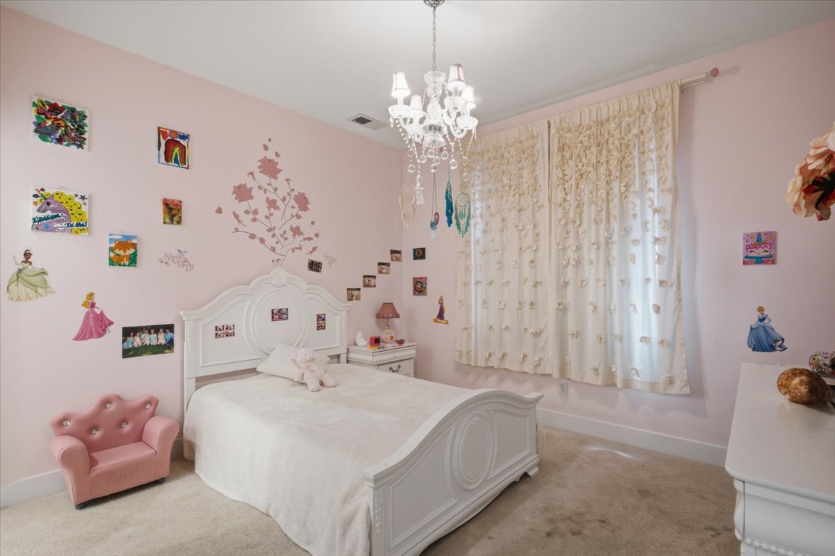 Plush carpeted flooring and pale pink walls
