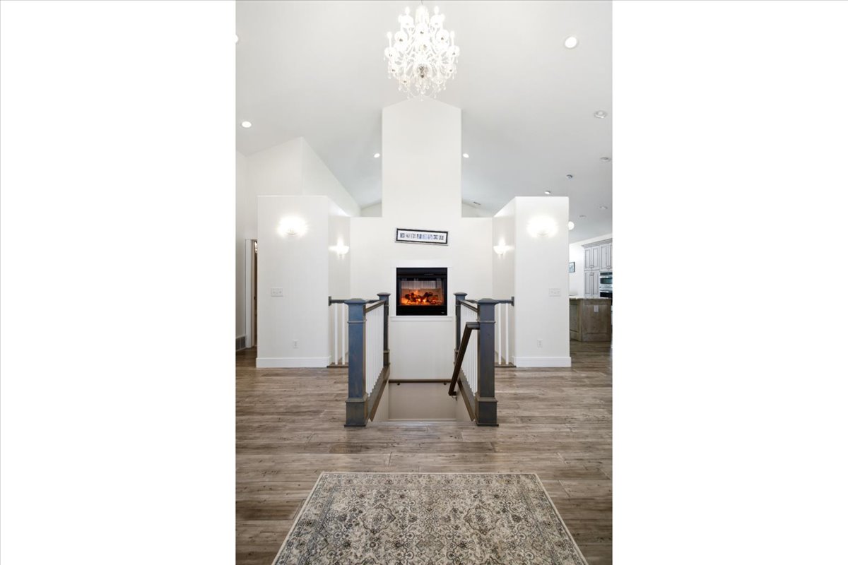 Central fireplace feature with a linear hearth and integrated electric firebox
