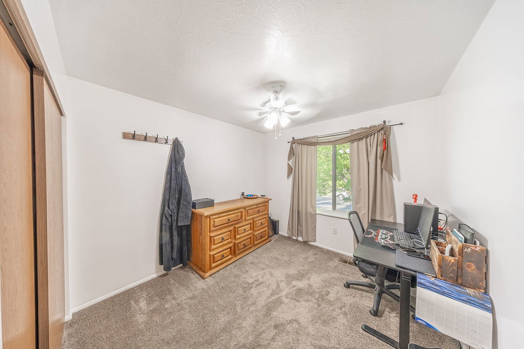 Interior space featuring neutral carpeting and white walls