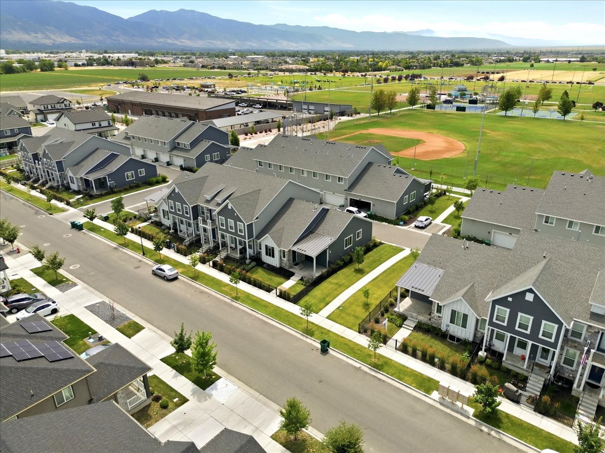 Modern residential community featuring varied architectural styles and mountain backdrops