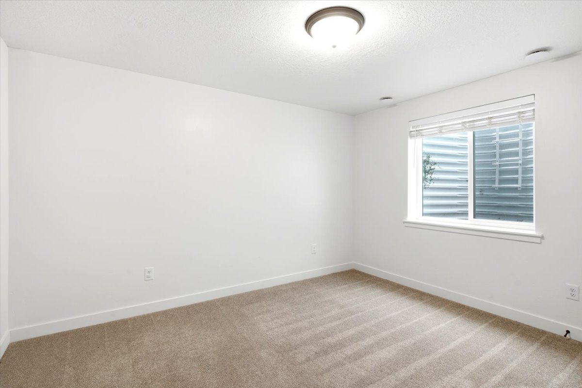 Room featuring neutral carpeting and white painted walls