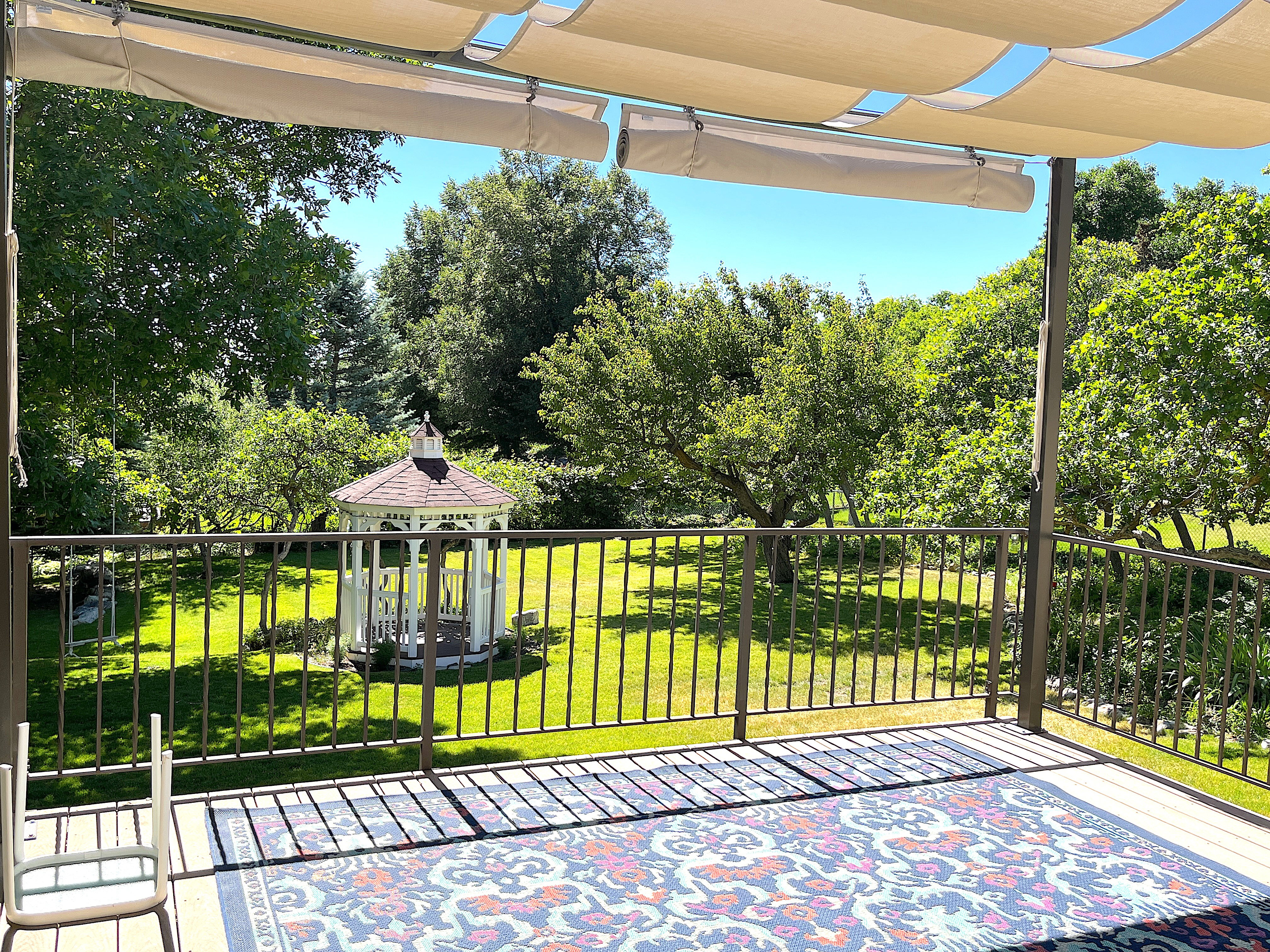 Expansive exterior decking with a retractable canopy