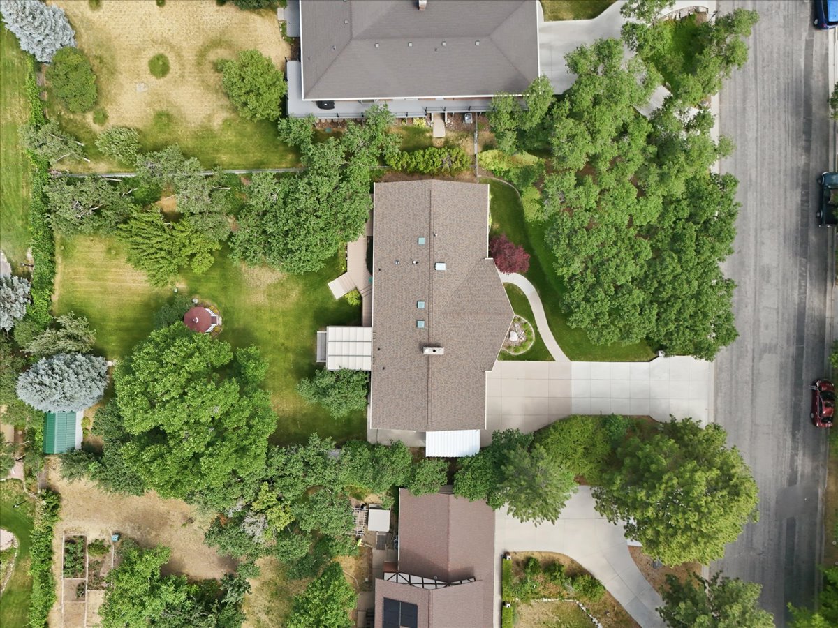 Spacious property featuring expansive lawns and mature trees
