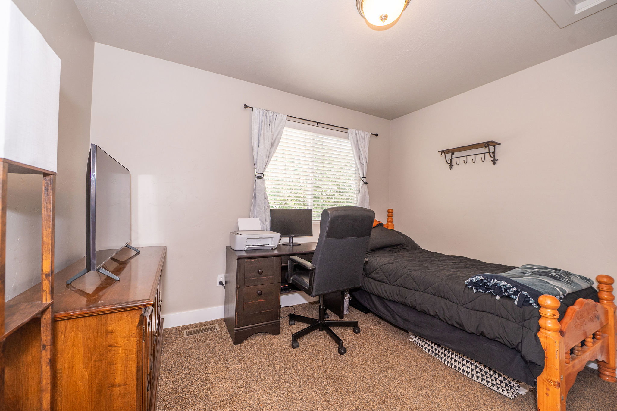 Room featuring carpet flooring and neutral wall tones