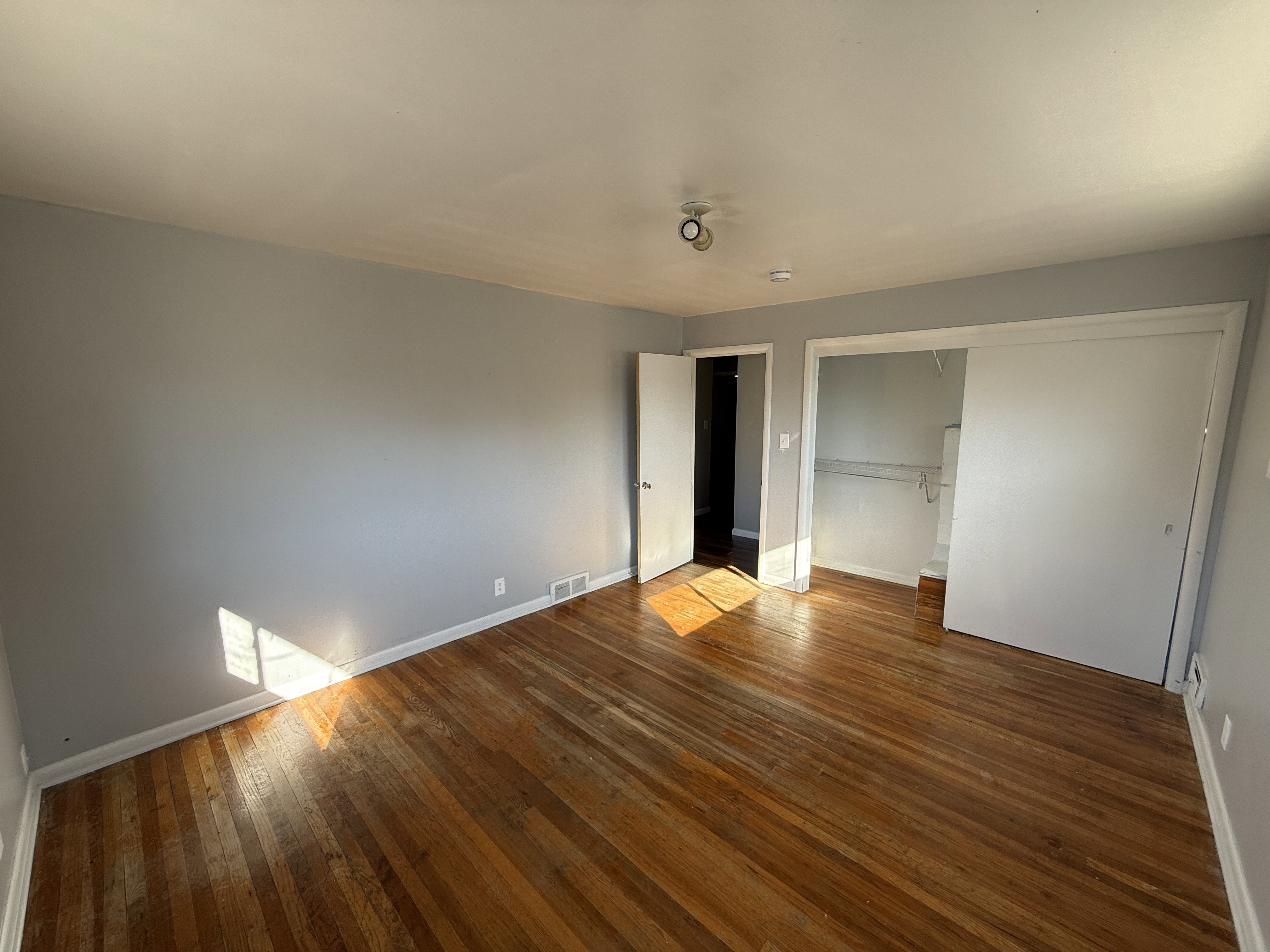 Hardwood flooring extending throughout the room