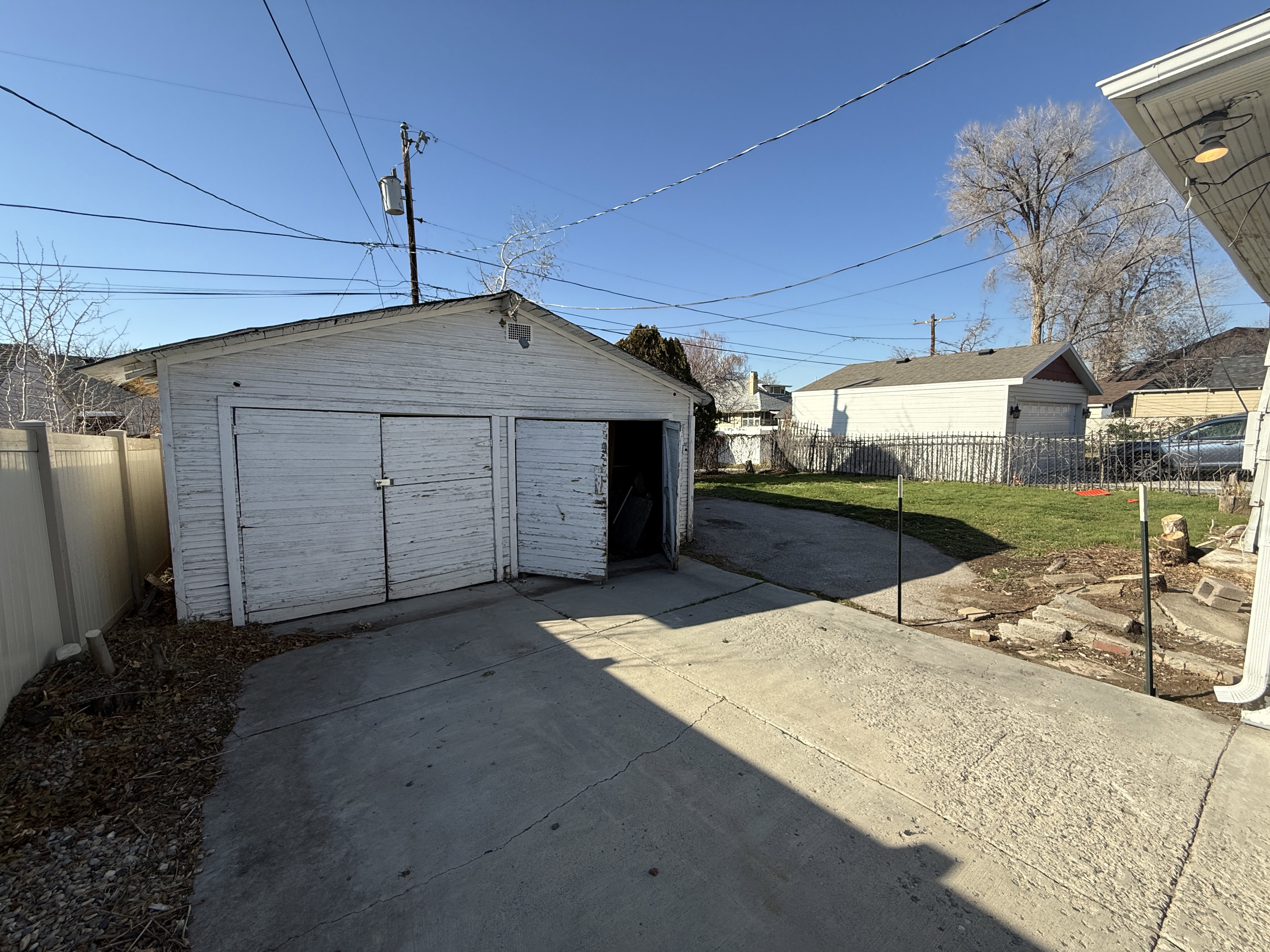 Detached two-car garage with concrete driveway
