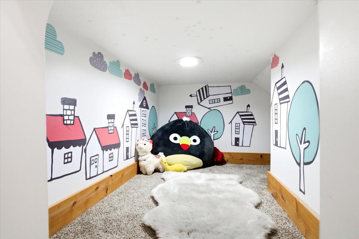 Fun kids alcove featuring  vibrant graphics and plush carpeting