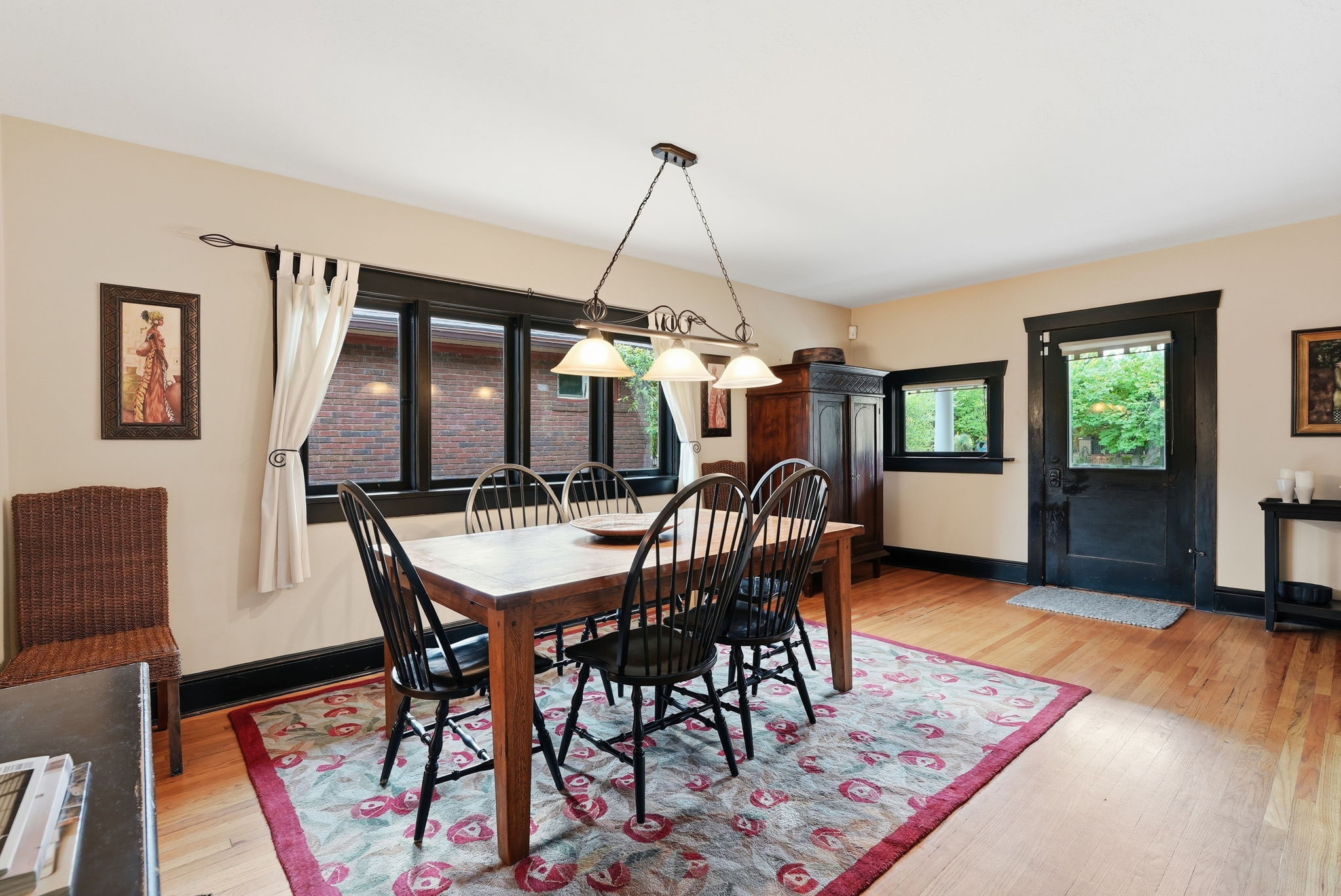 Hardwood flooring throughout the room, complemented by dark trim around windows and doors