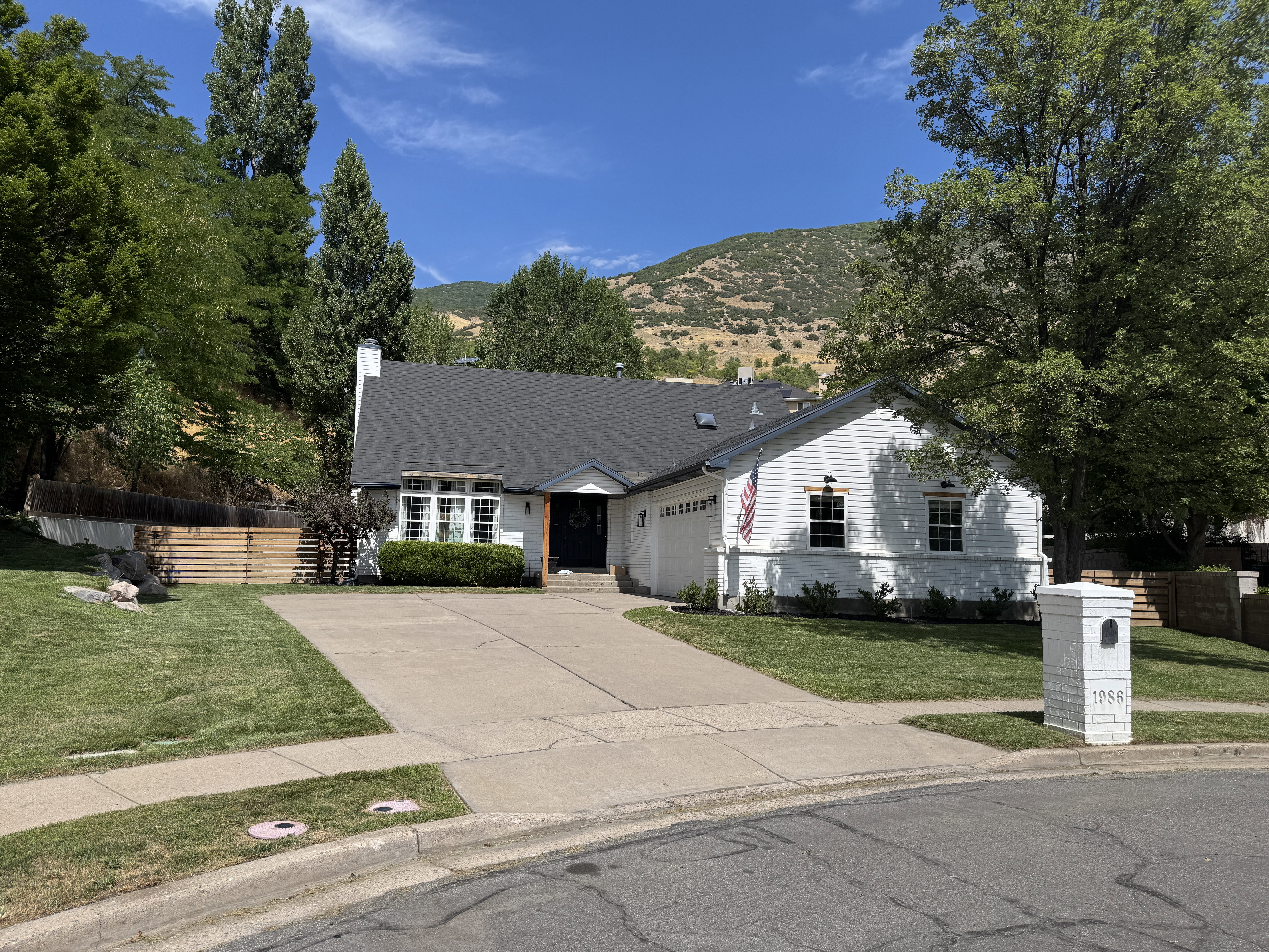 White exterior siding with dark trim accents