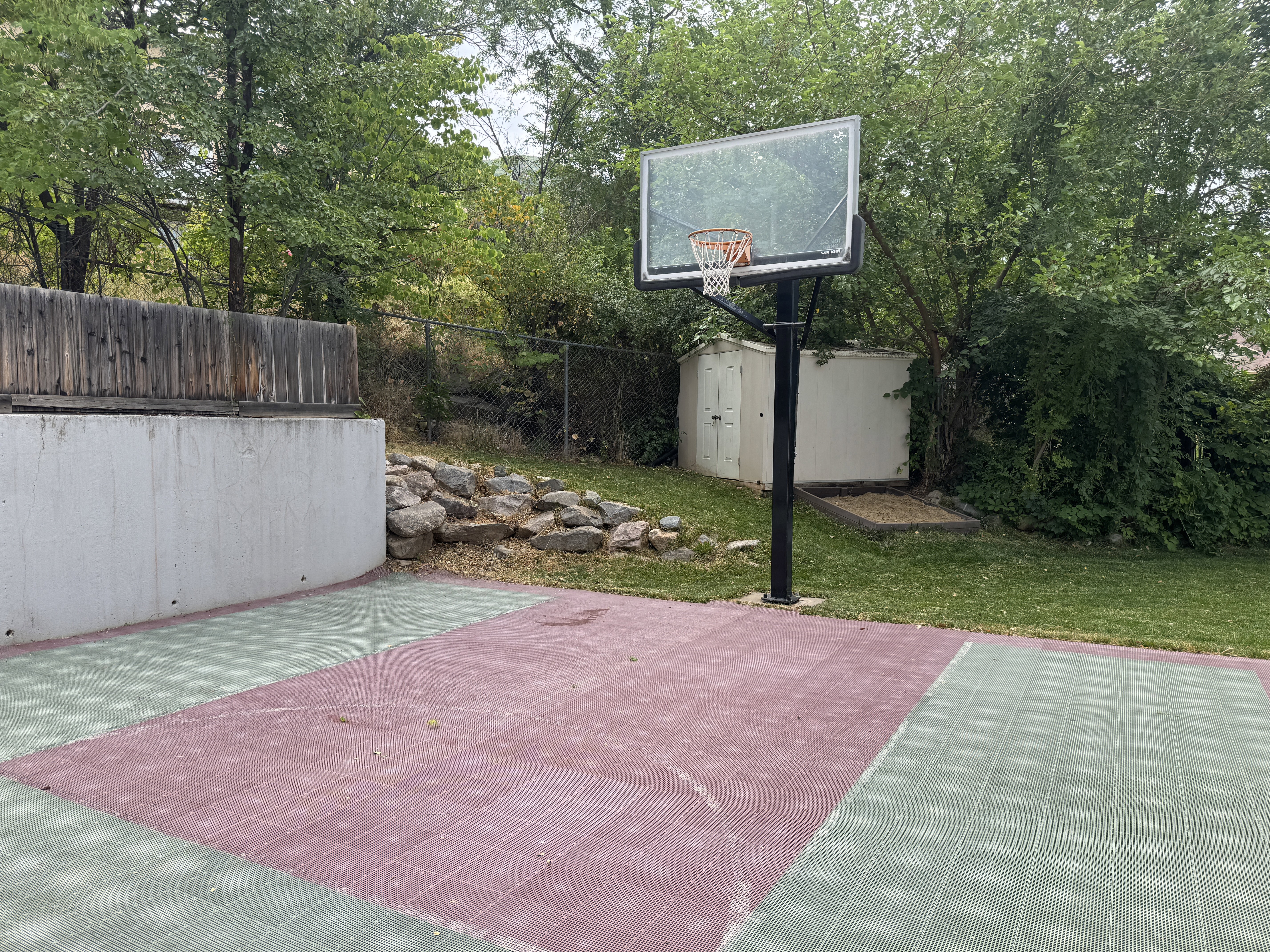 Outdoor sport court featuring red and green surfacing