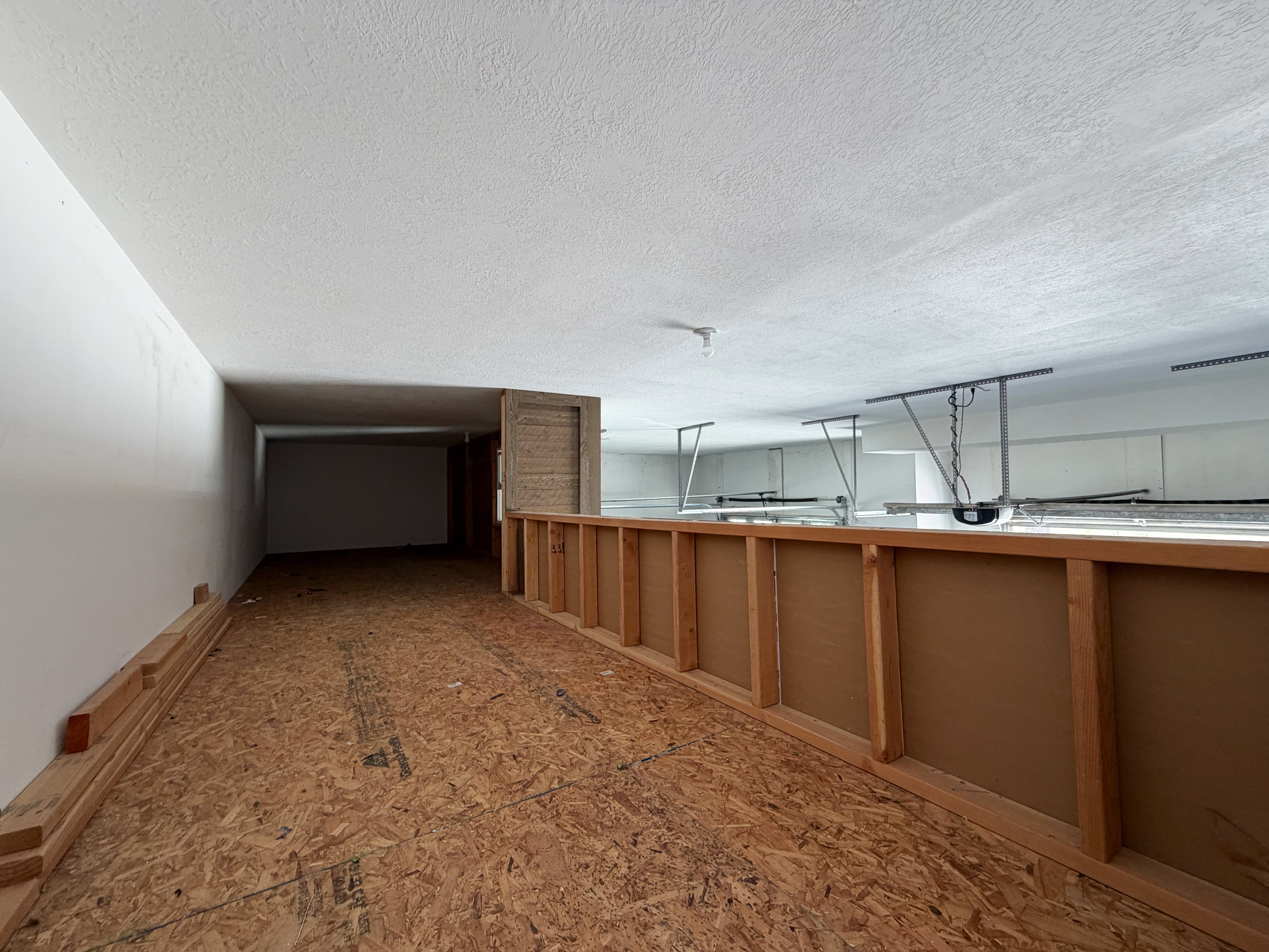 Mezzanine storage space above the garage.