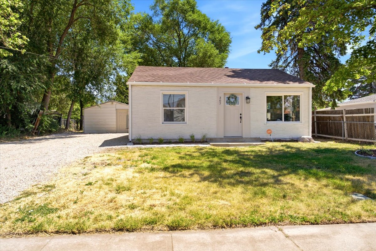 White exterior with brown shingle roofing