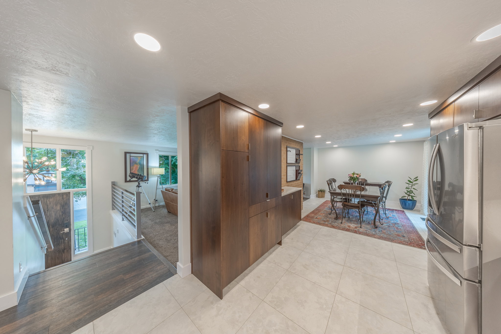 View of entryway and one view of the kitchen/dining area