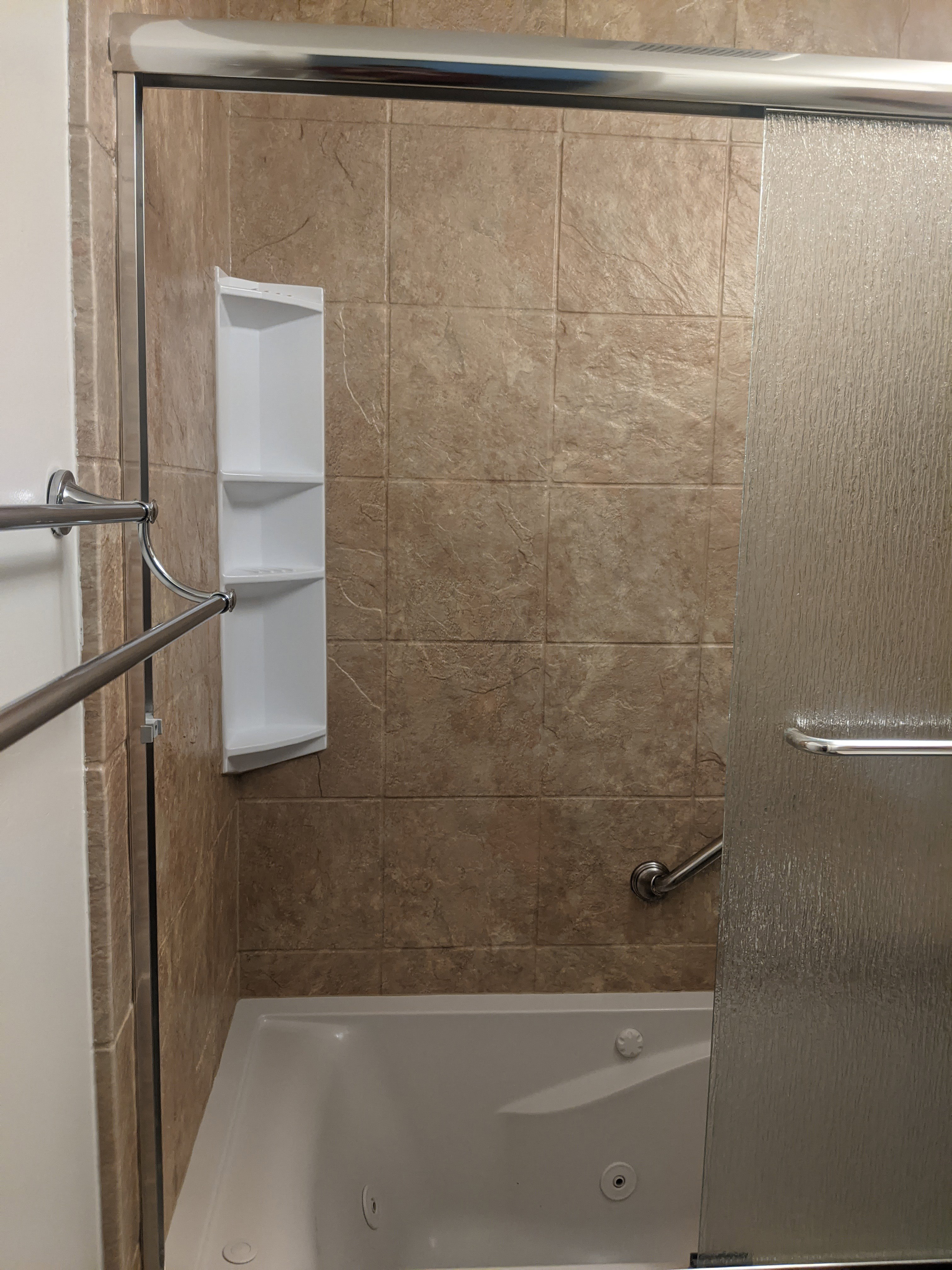 Tiled bath and shower combination with a jetted tub