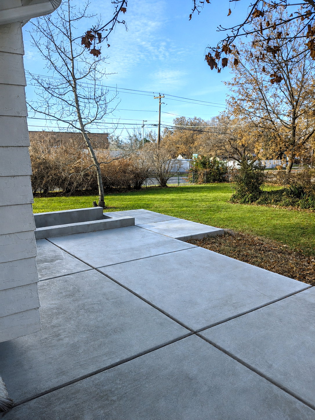Exterior featuring a concrete walkway and steps