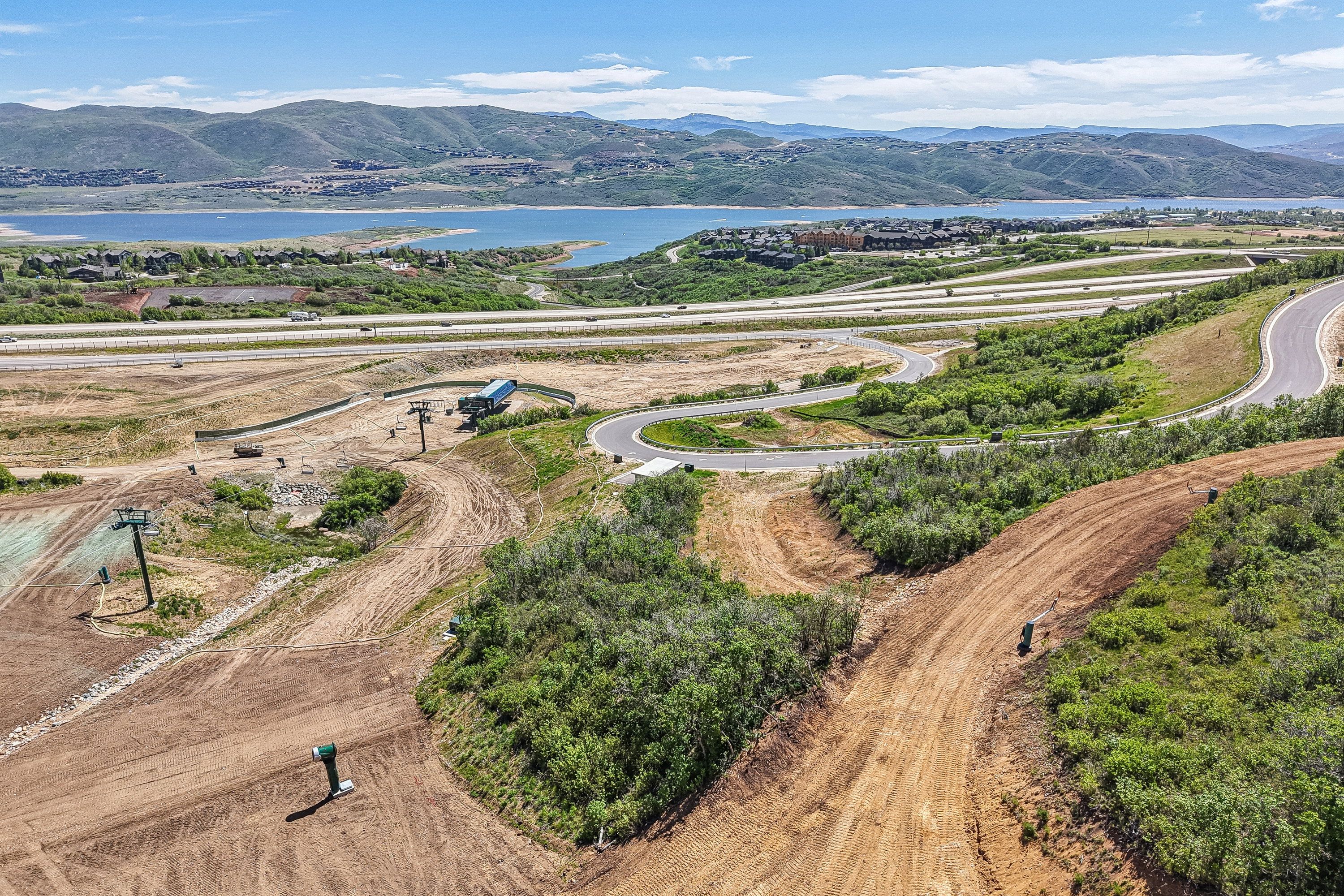 Expansive land parcel featuring existing ski lift infrastructure and curving roadways