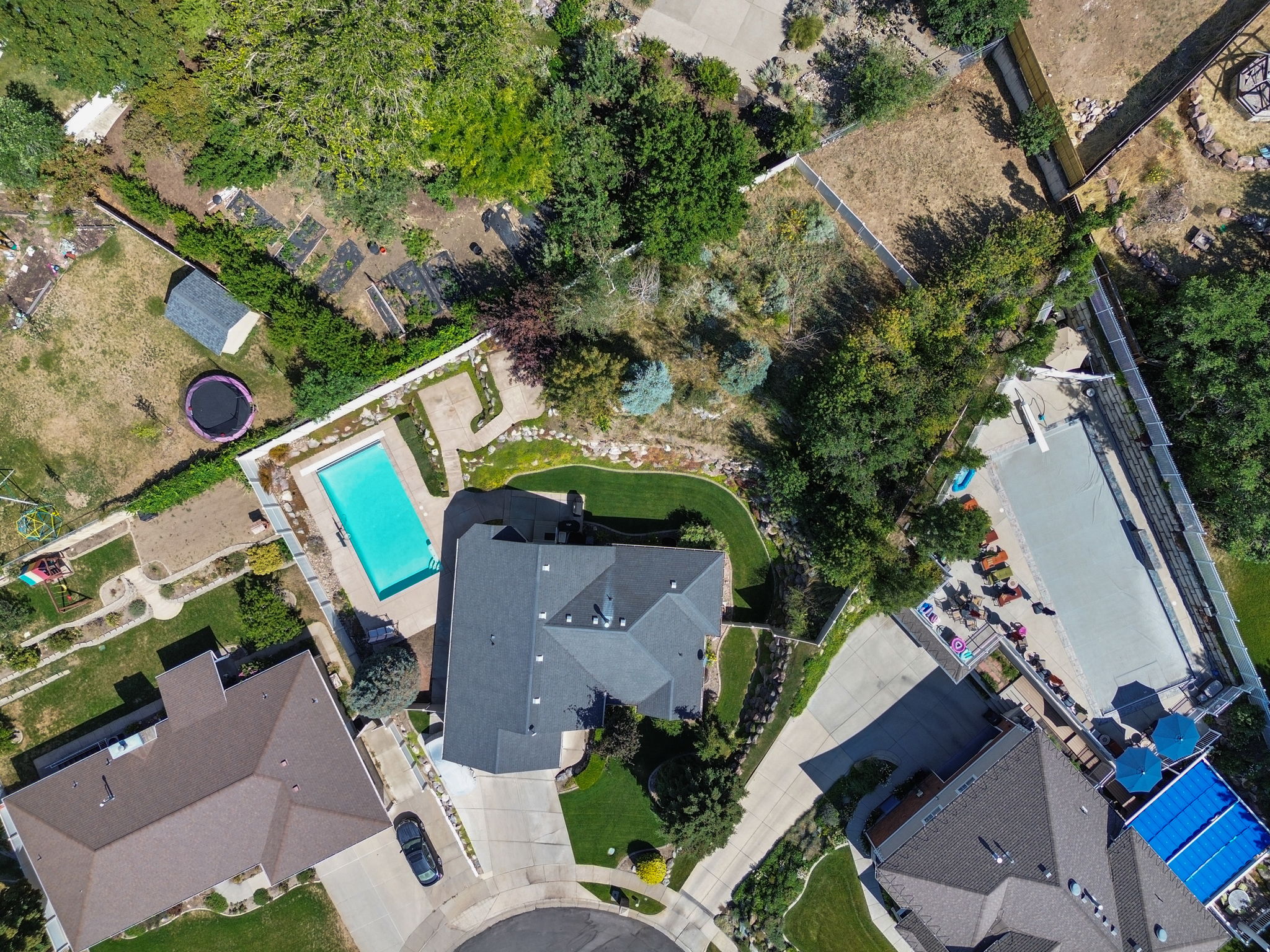Property extends beyond the fence at the top of the hill with a large field at the top as pictured in the top right corner of this picture.