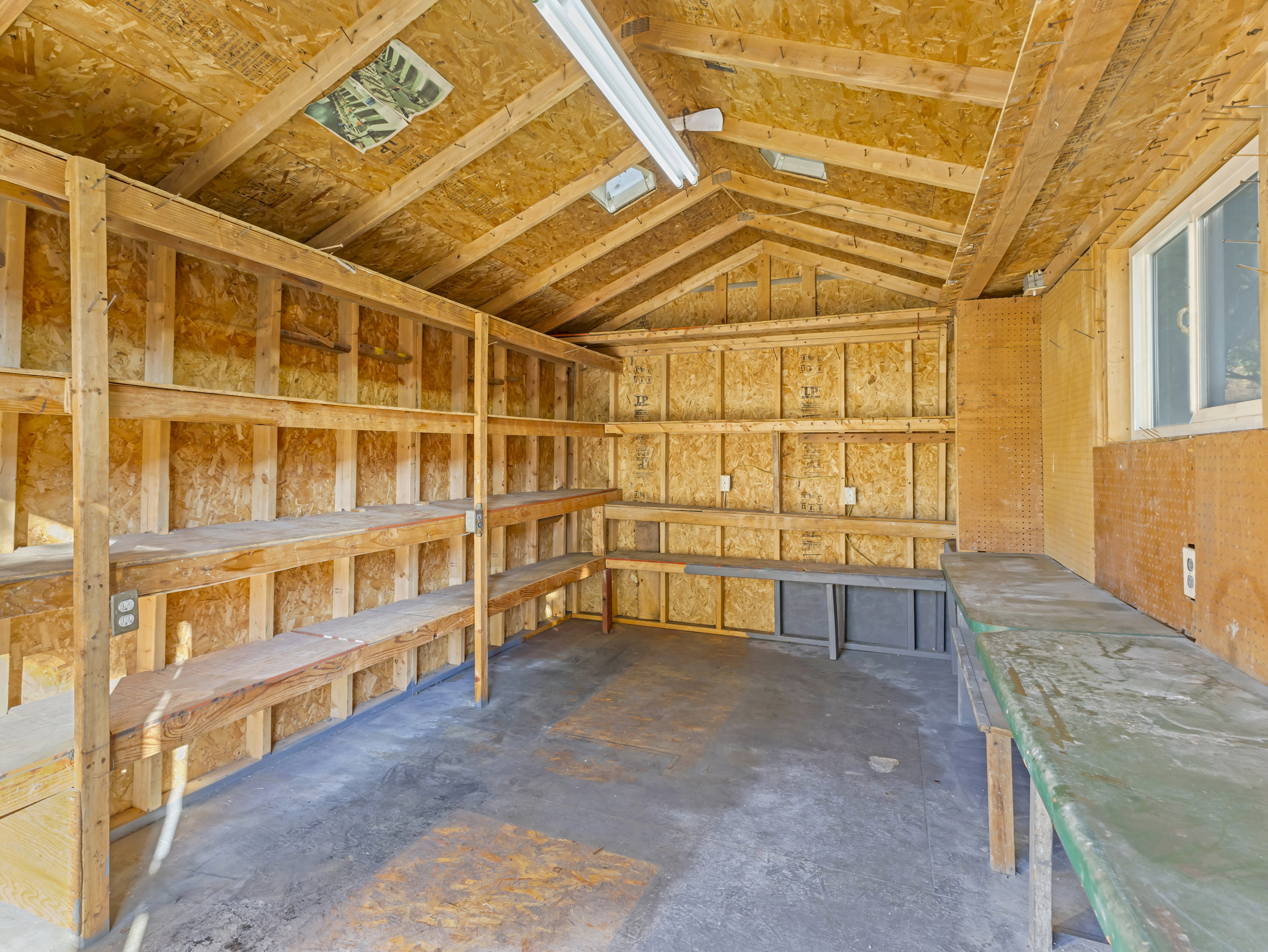 Utility structure with exposed wood-finish walls and ceiling