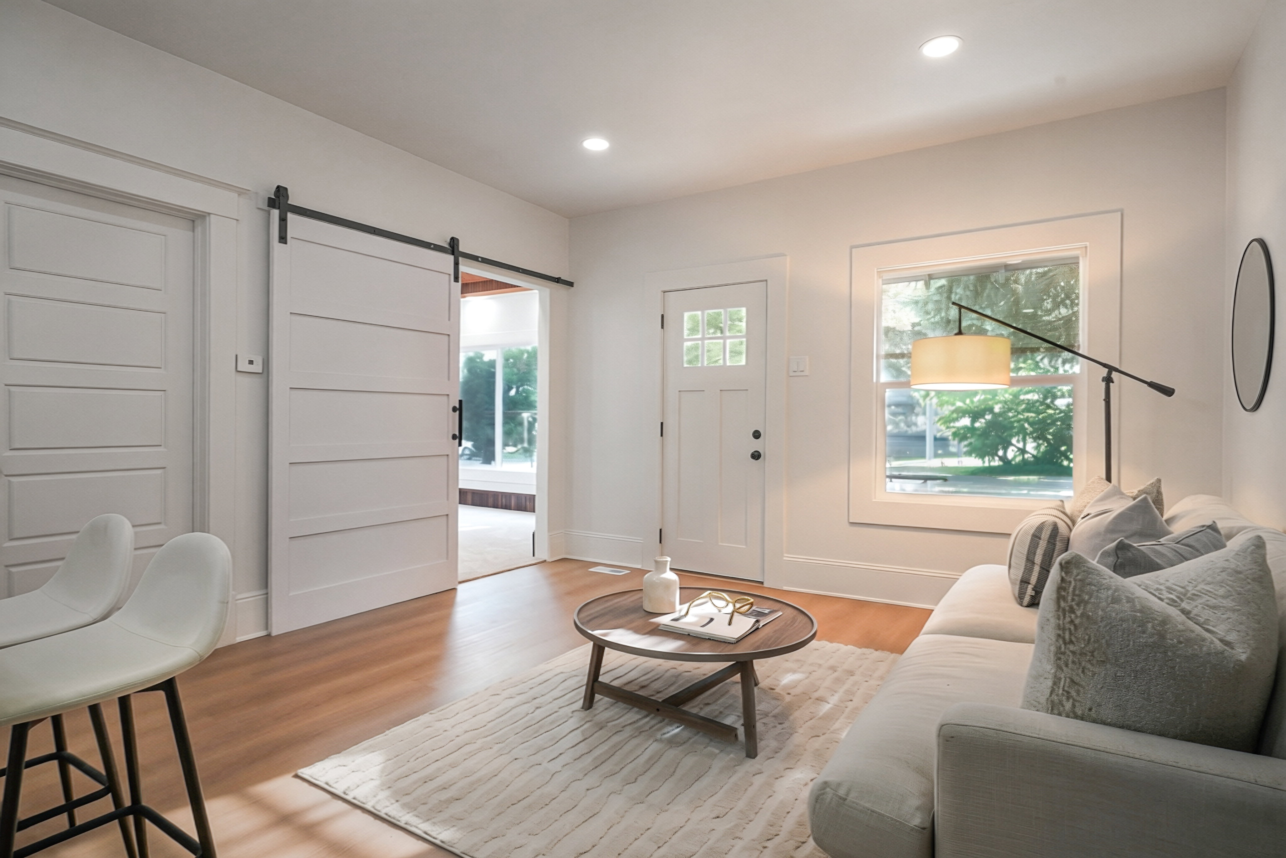 Interior space featuring wood-finish flooring, white walls, and recessed lighting