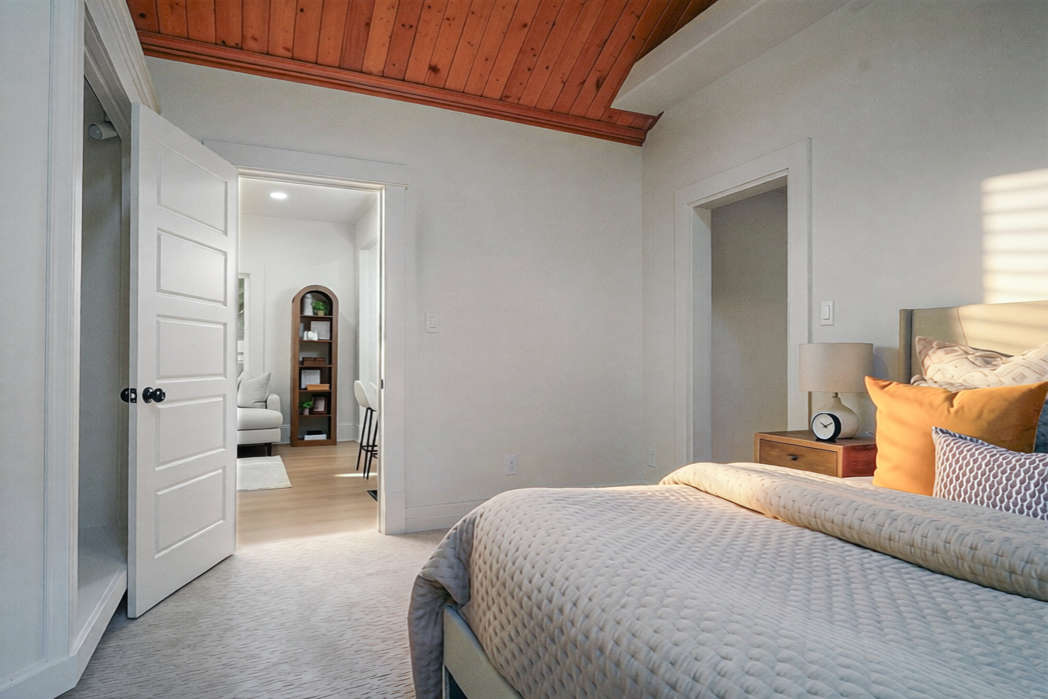 Vaulted wood-paneled ceiling with white painted beams