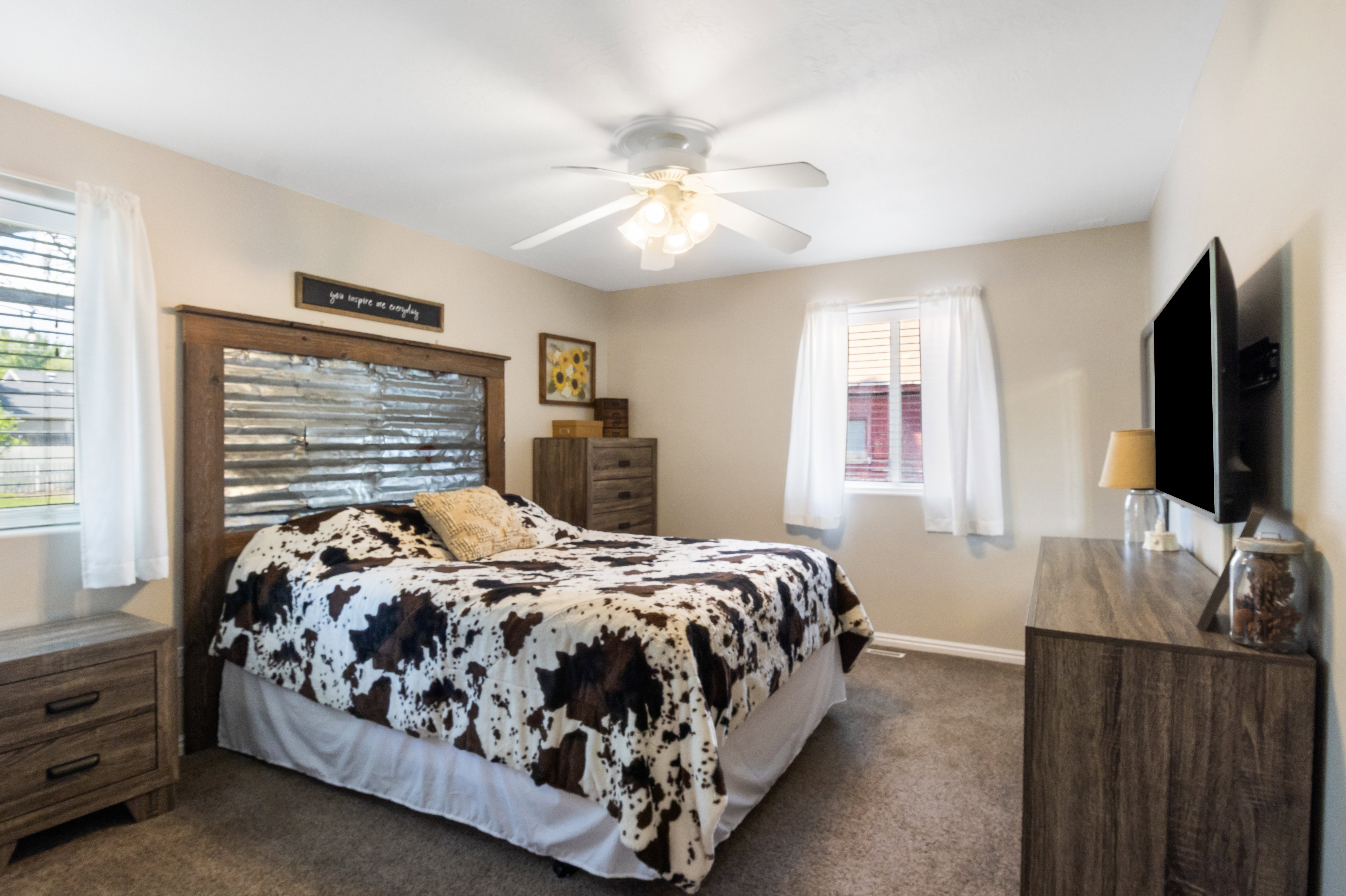 Neutral-toned walls complement plush carpeting