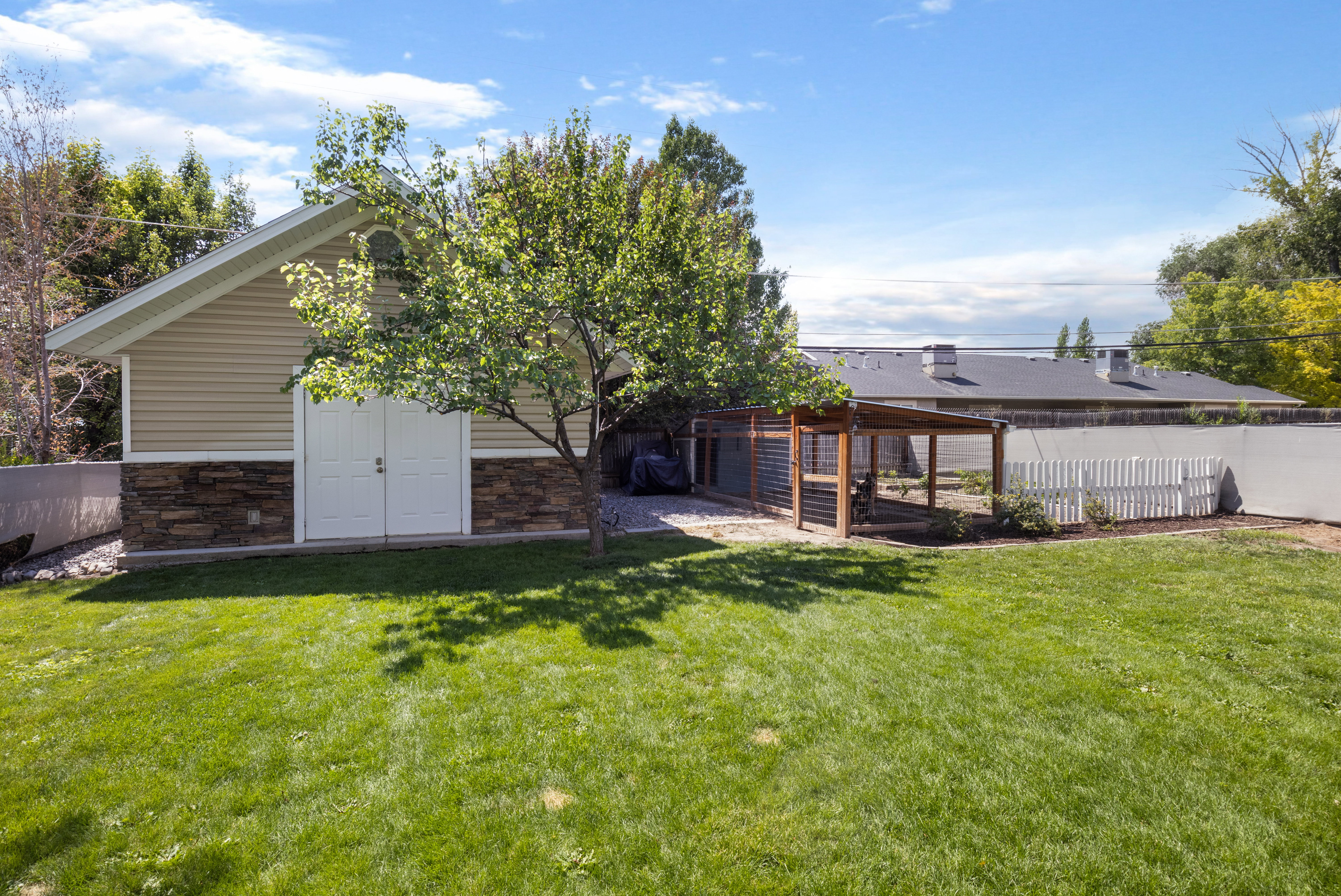 Expansive backyard featuring a manicured lawn