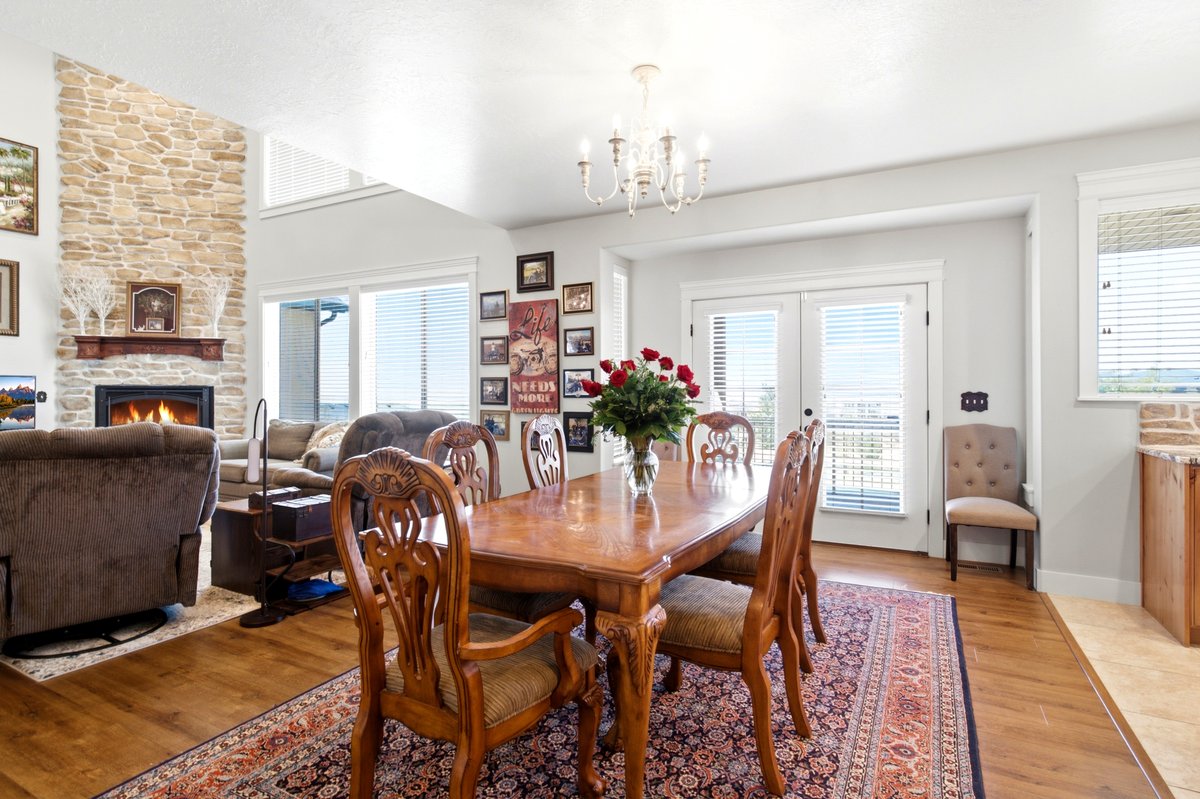 Dining area featuring wood-finish flooring and a decorative chandelier