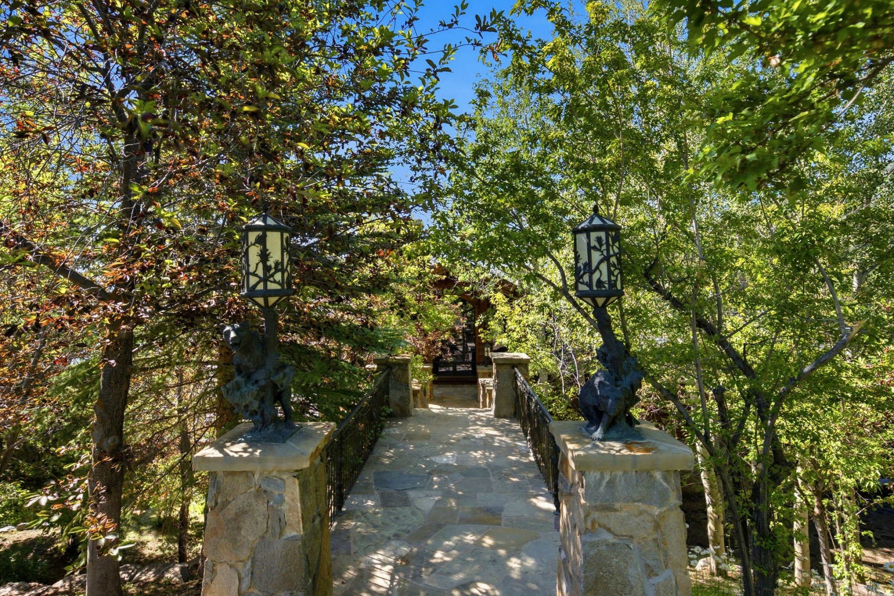 Stone pathway featuring decorative iron railings