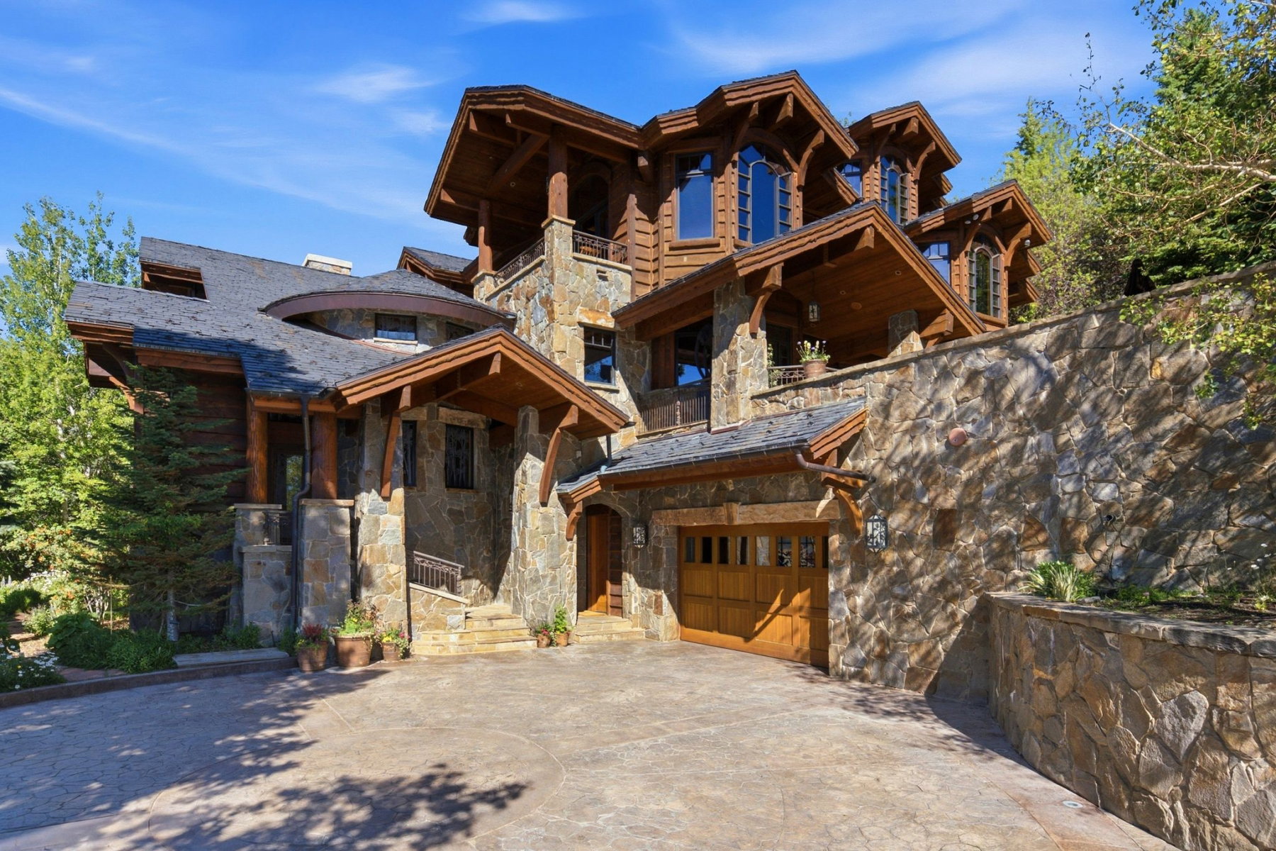 Multi-level stone and timber facade with gabled dormers