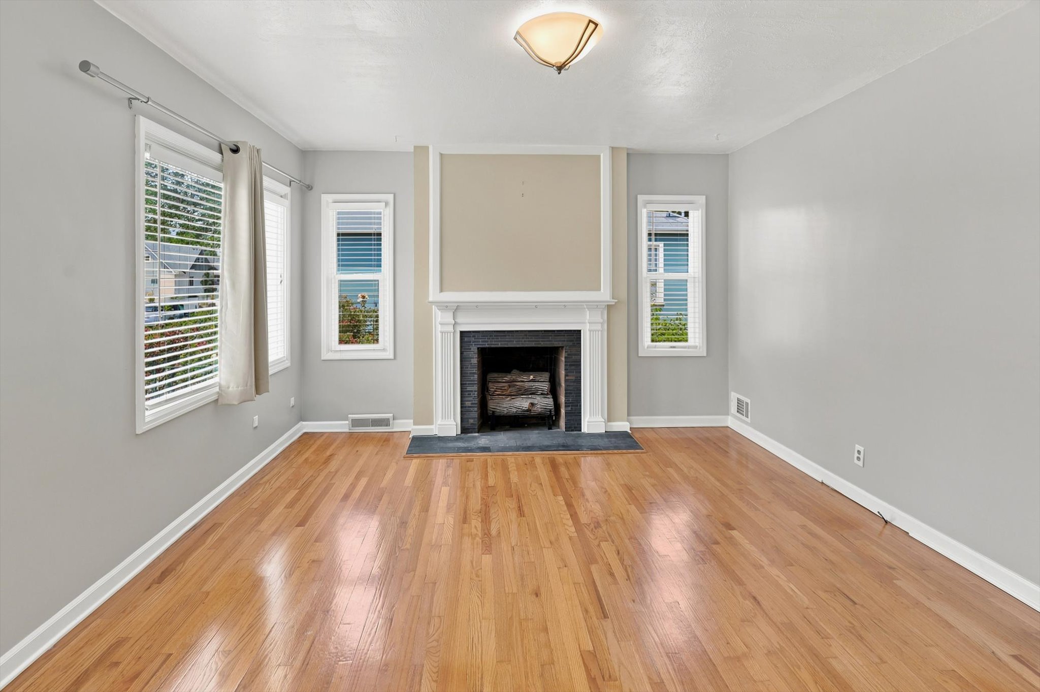 Beautiful Hardwood flooring, wood burning fireplace