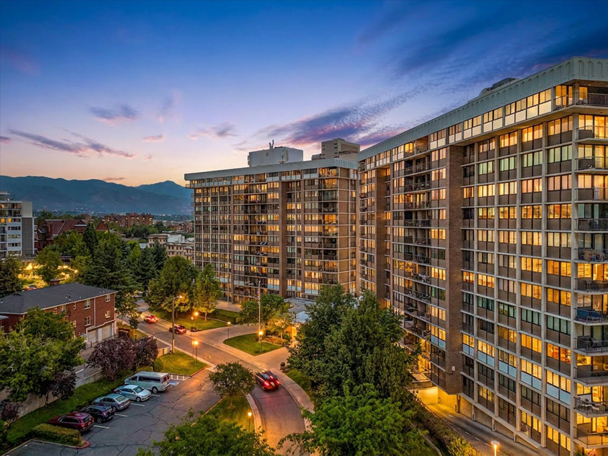 Multi-story residential buildings featuring extensive window lines and private balconies