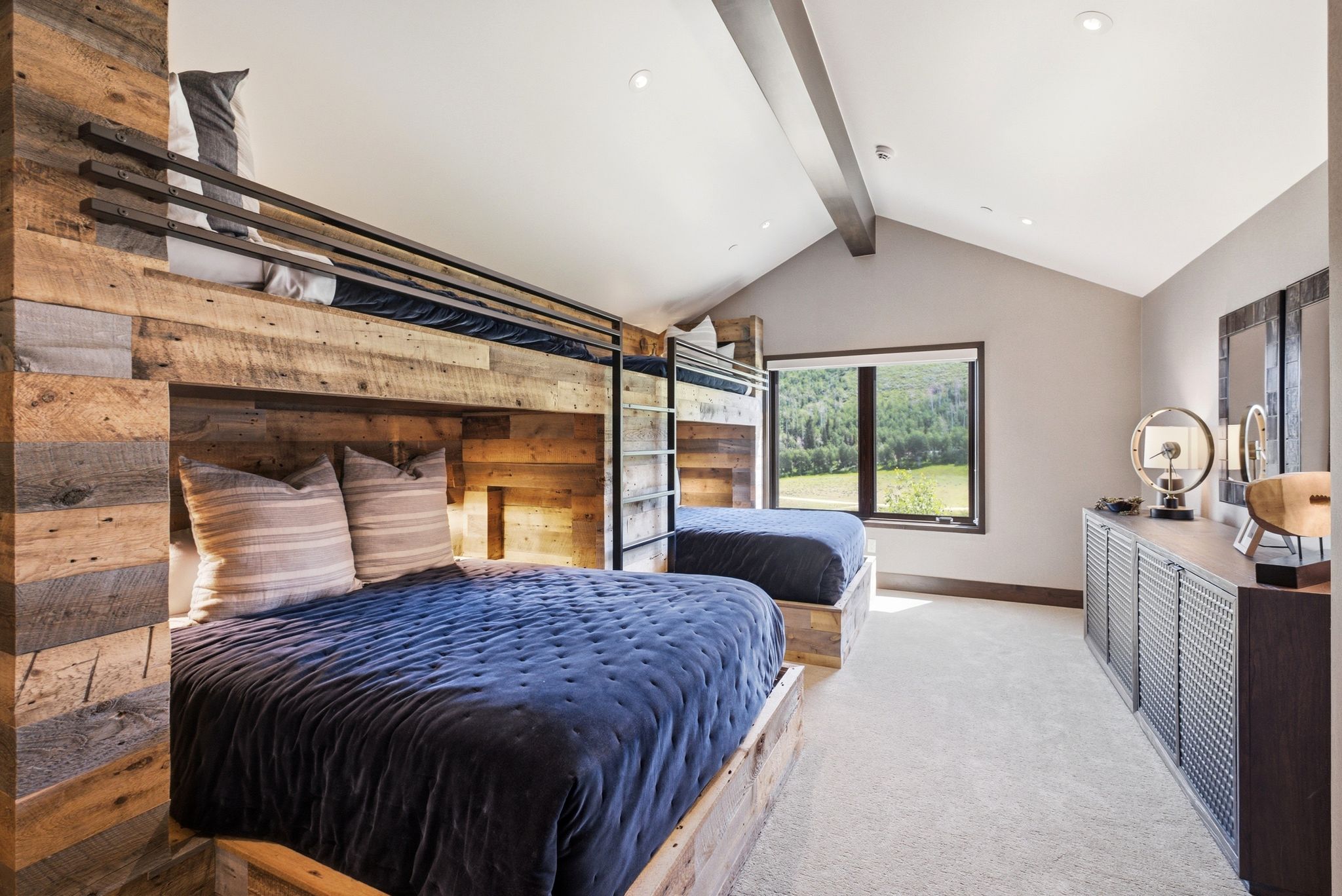 Custom-built bunk beds with reclaimed wood finishes