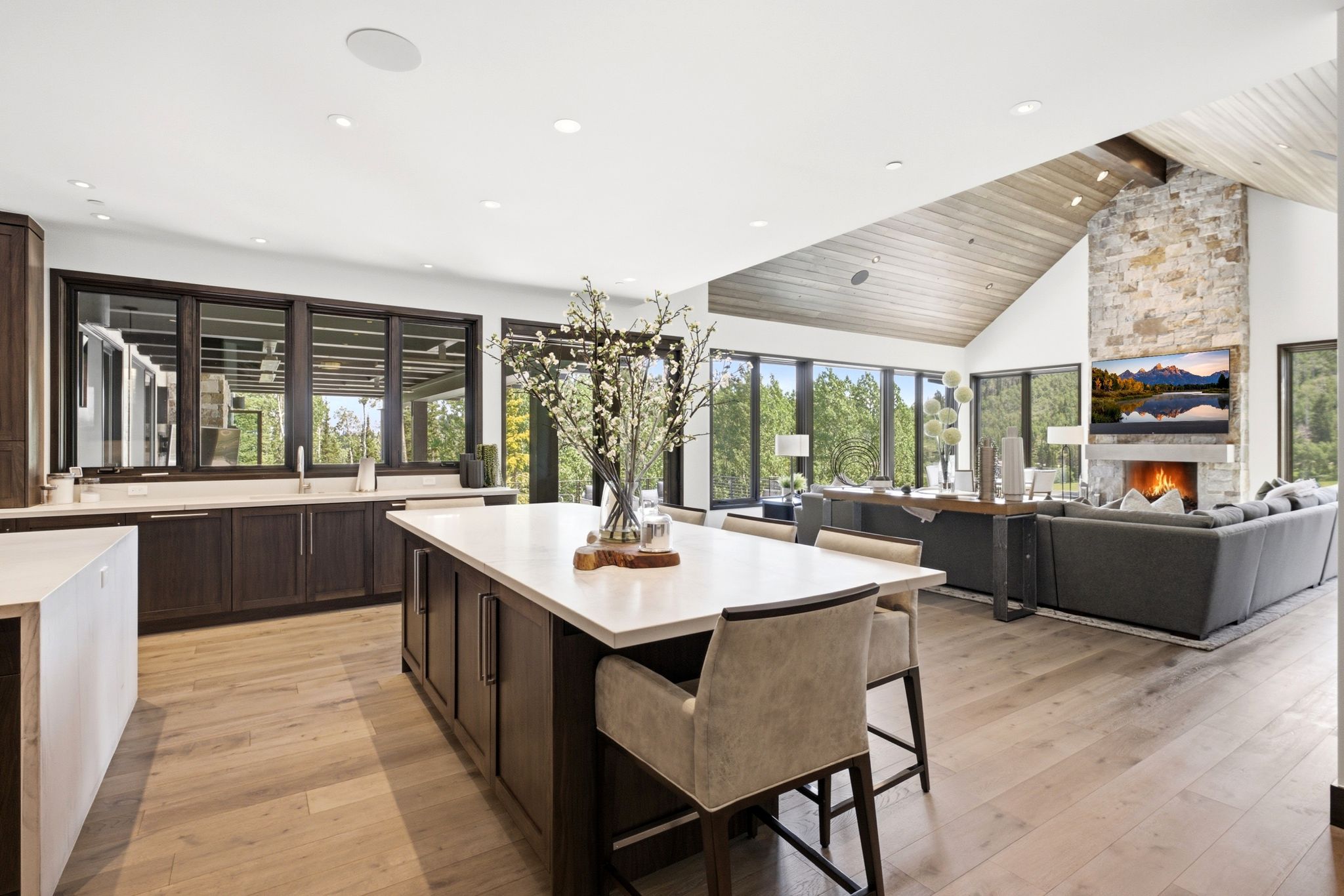 Open-concept living space with light wood-finish flooring