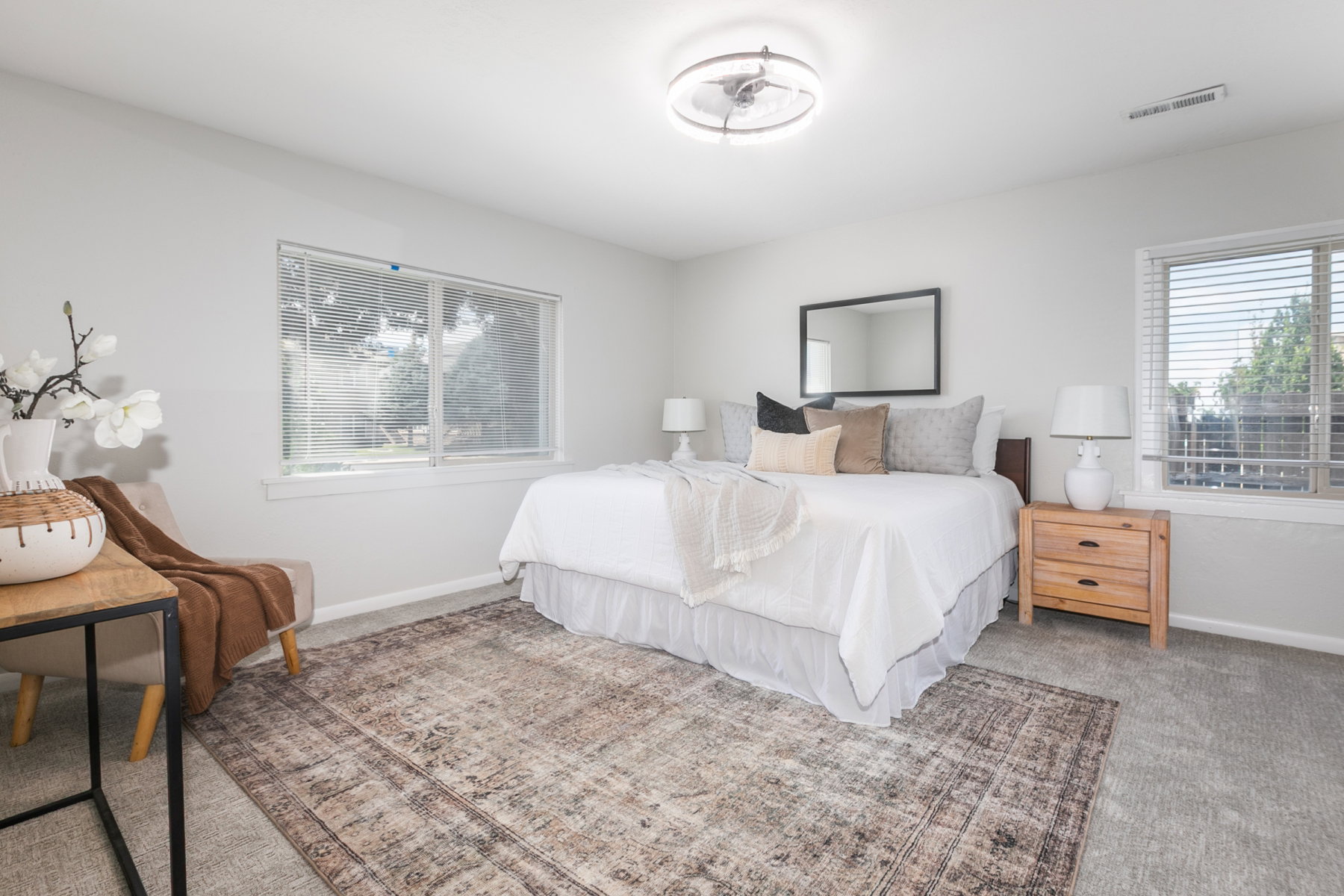 Bedroom featuring light gray carpeting and white walls