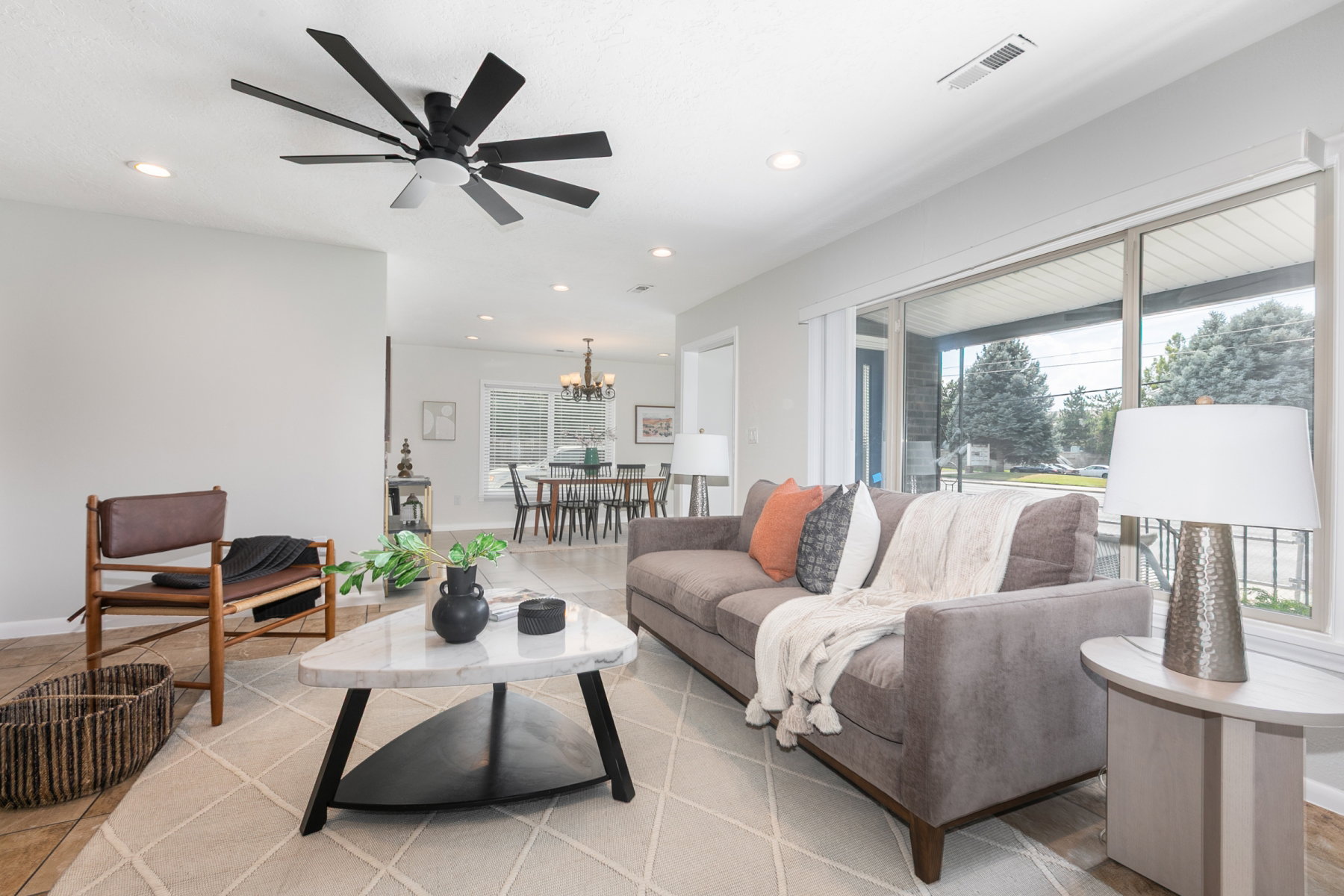 Open concept living area featuring recessed lighting, a modern ceiling fan, and light-colored walls