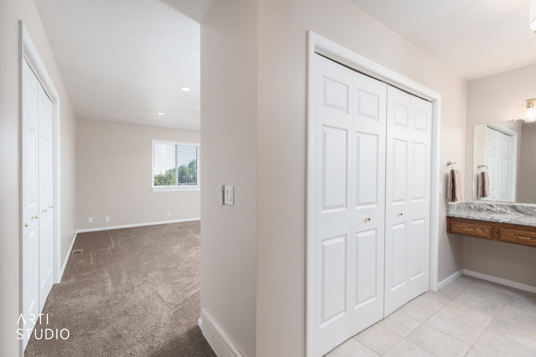 Spacious bedroom featuring carpet flooring, recessed lighting, and a large window