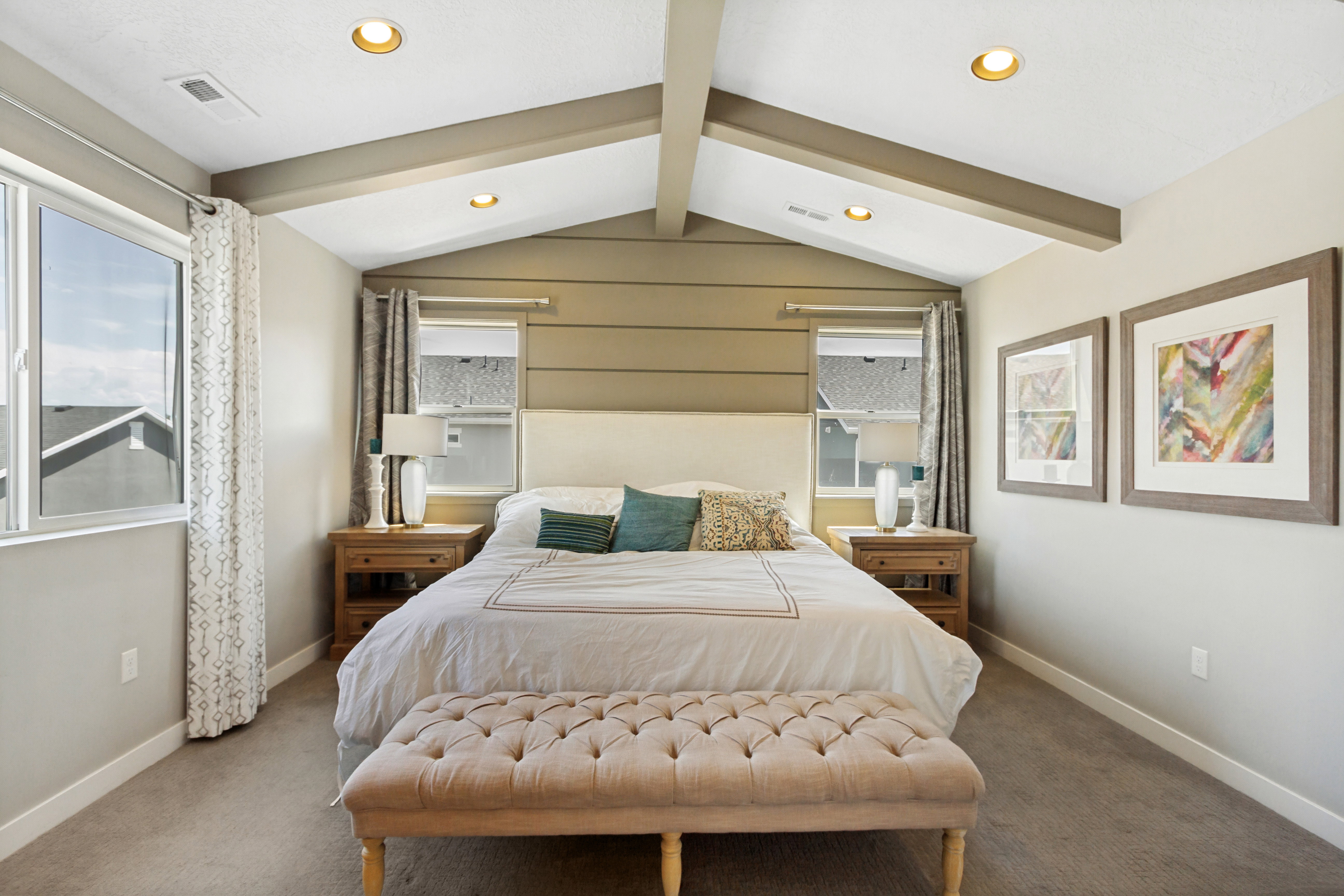 Vaulted ceiling featuring exposed beams and recessed lighting