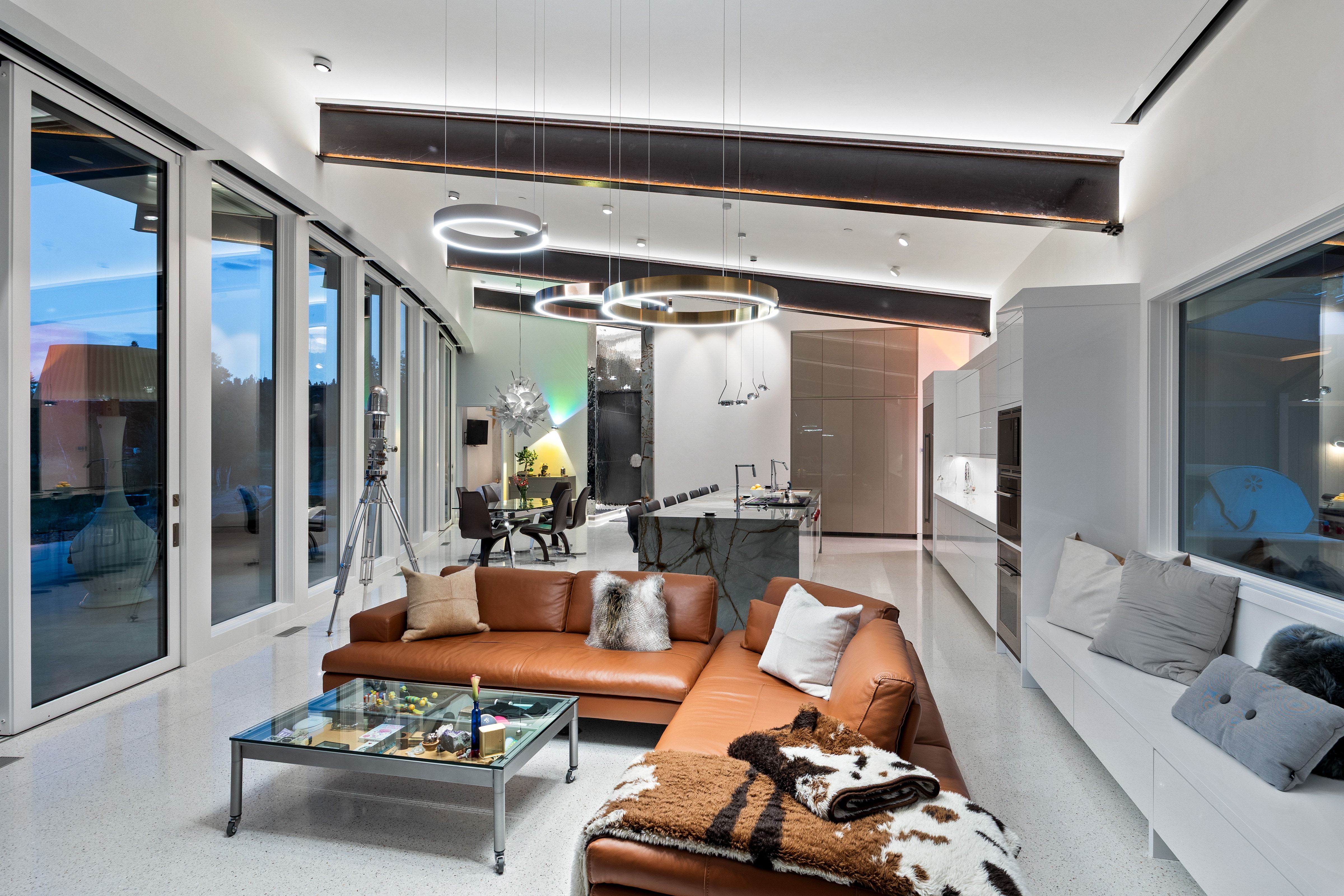 Open-concept living space with extensive floor-to-ceiling windows