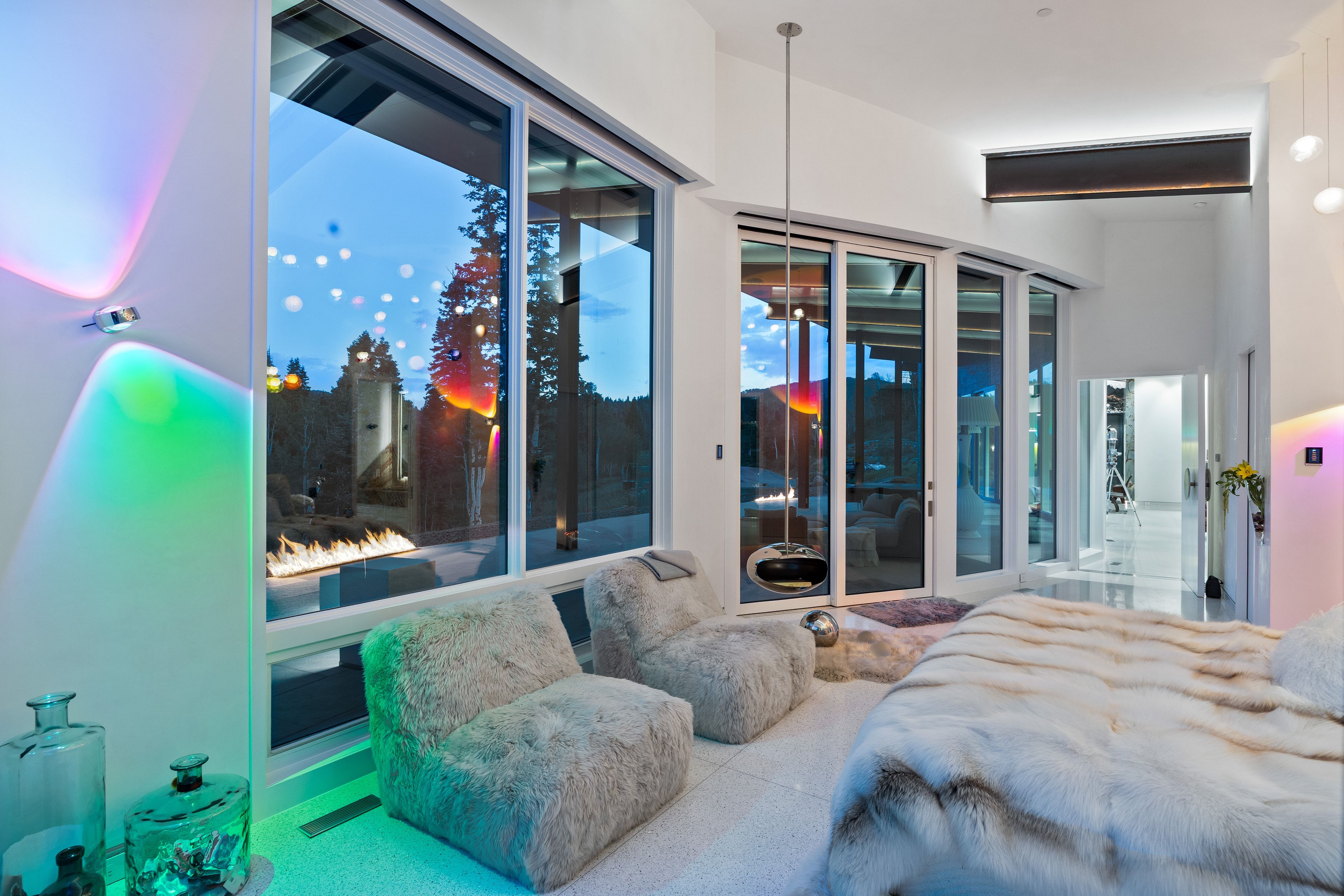 Expansive room featuring multiple full-height windows and glass sliding doors, providing abundant natural illumination