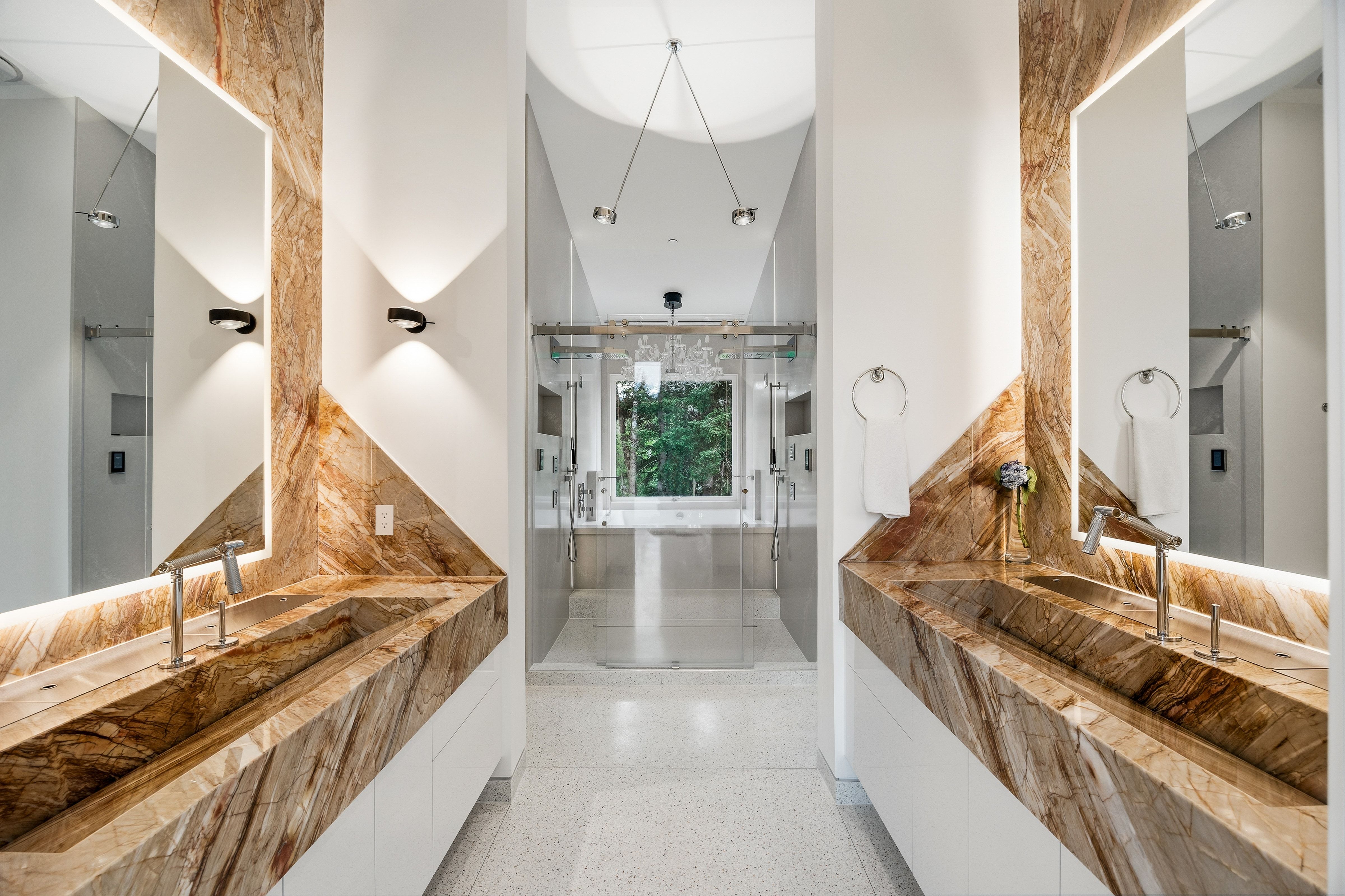 Dual vanity with integrated stone sinks and back-lit mirrors