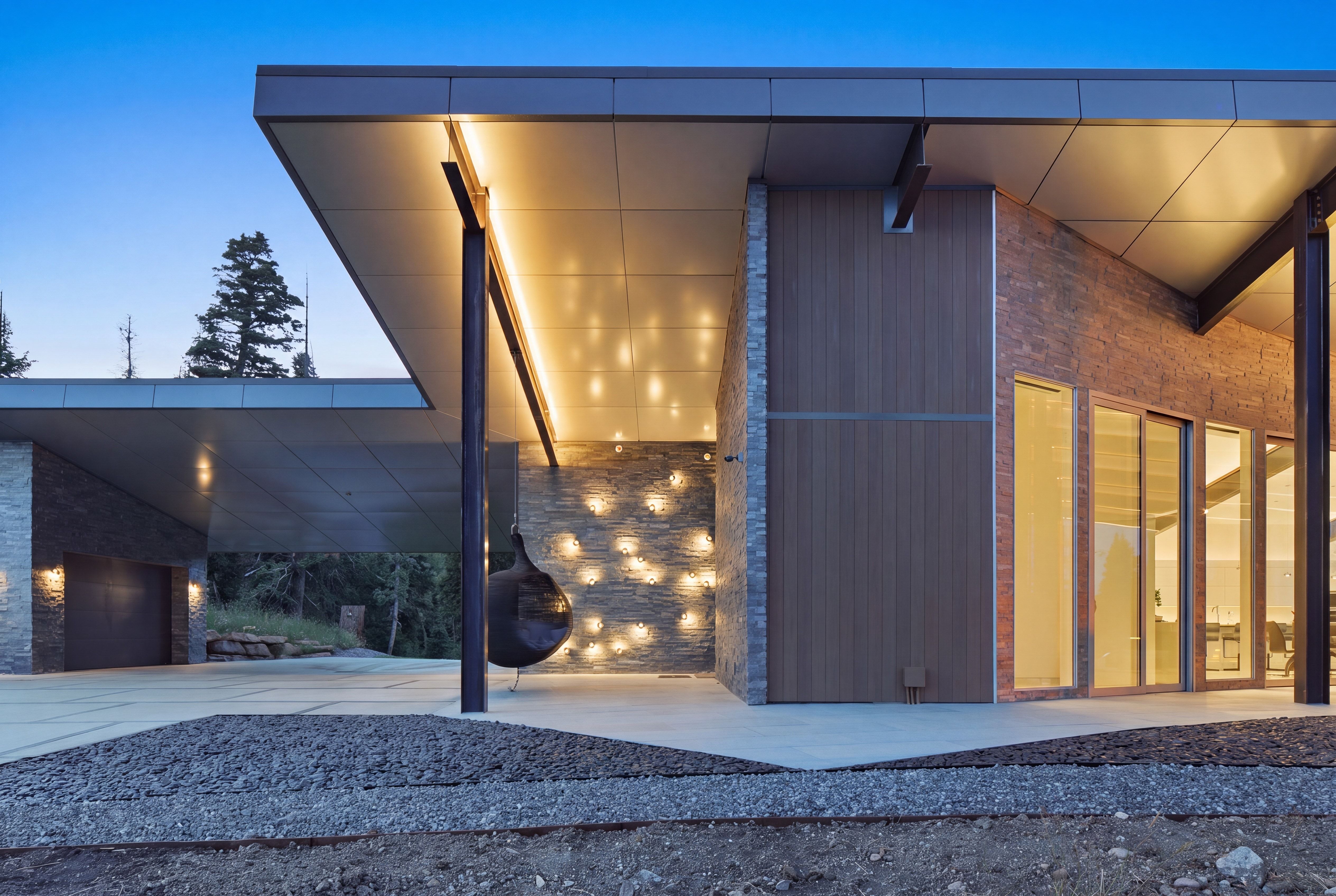 Modern architectural exterior featuring stone and wood paneling