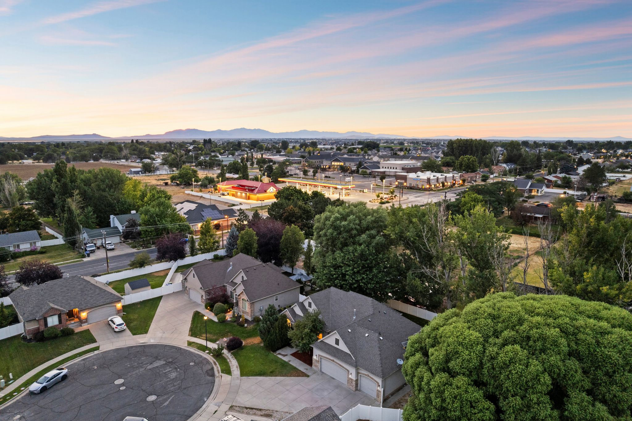 Aerial perspective highlighting residential properties within a neighborhood setting