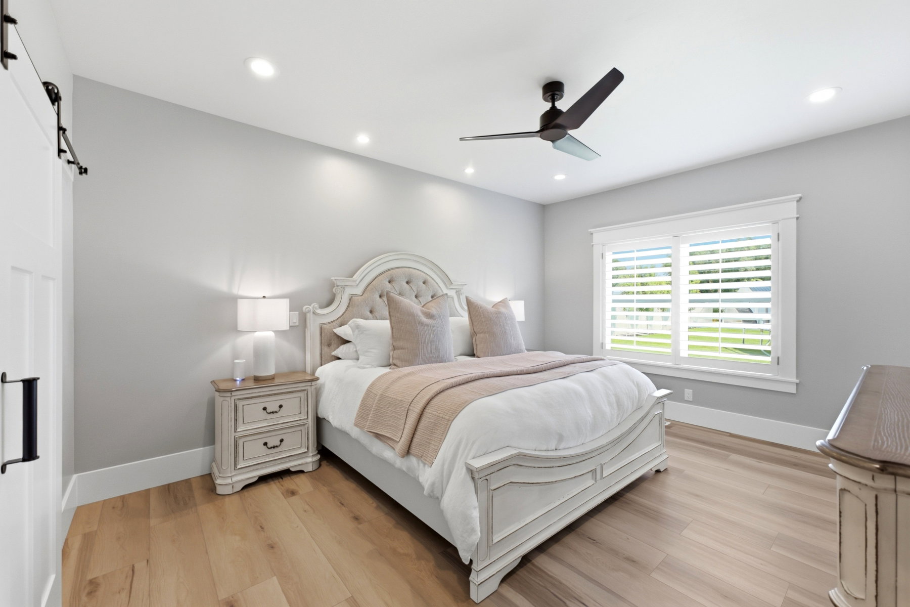 Room featuring recessed lighting, a ceiling fan, and wood-finish flooring